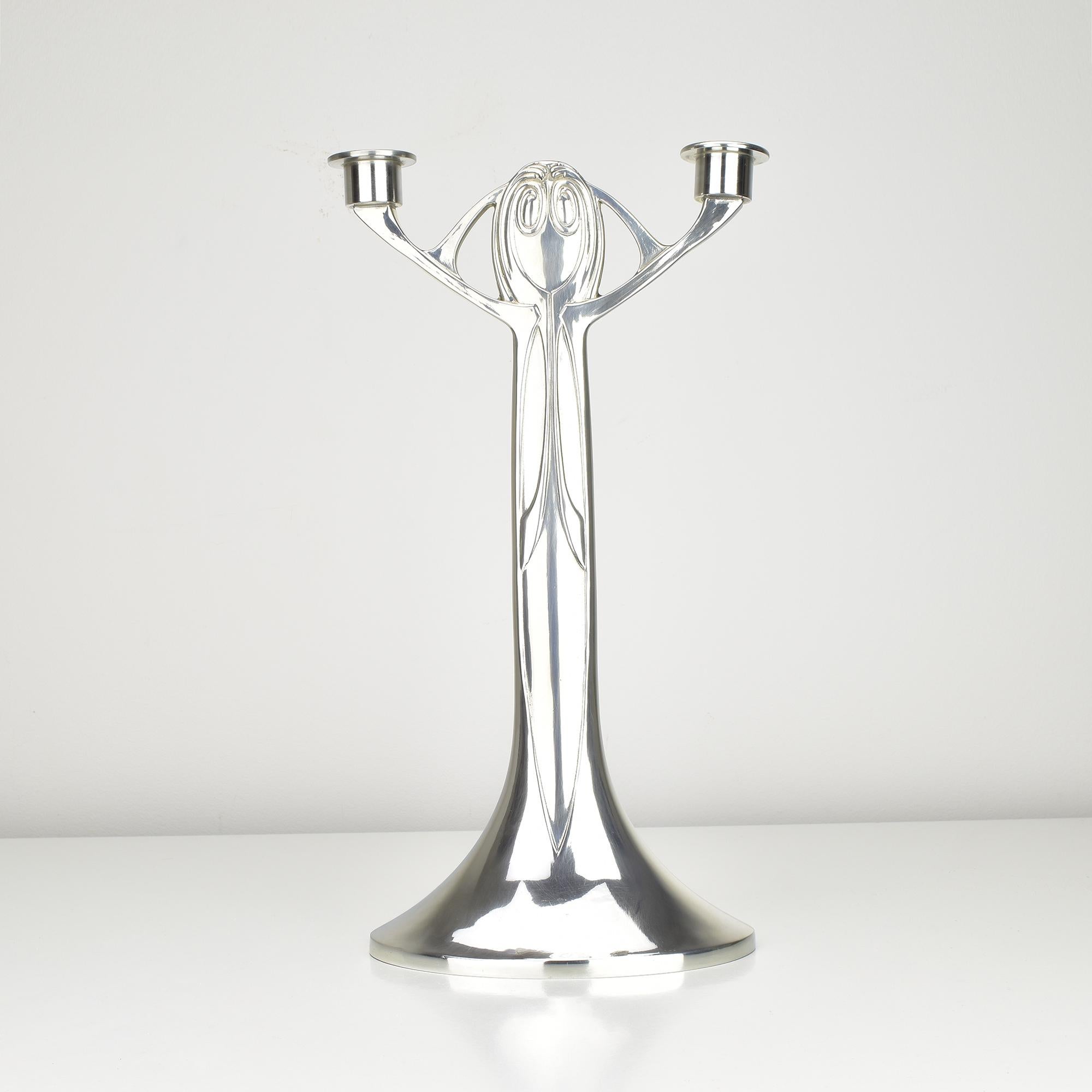 This impressive candleholder is a striking reproduction of a design by the renowned Austrian architect and designer Joseph Maria Olbrich, produced by Kayserzinn in the 1980s. Crafted in pewter with a high polish, it showcases Olbrich's distinctive