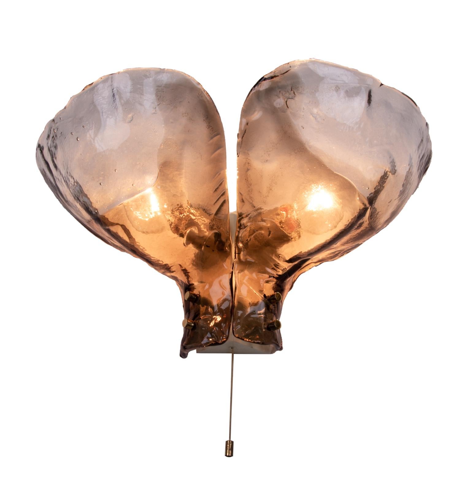 Elegant large wall light designed by J.T. Kalmar made of amber Murano glass elements fixed on a nickel backplate. Beautiful play of light when lit. Gem from the time. With this light you make a clear statement in your interior design. A real