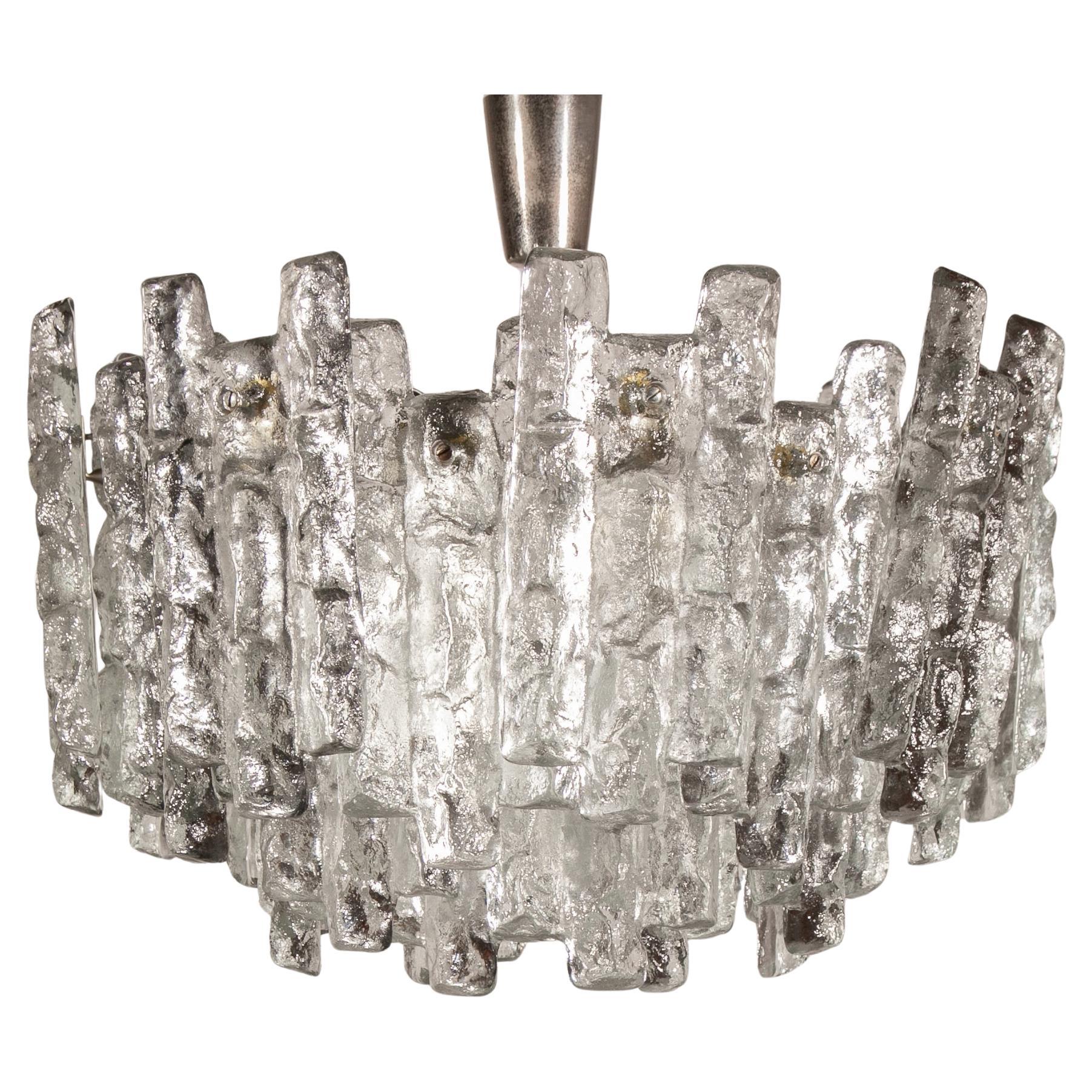 A beautiful large chandelier with massive ice glasses made by Kalmar, Germany,  three tiers structure glasses, beautifully refracting the light, very high quality in very good condition. Cleaned, well-wired, and ready to use. The fixture requires