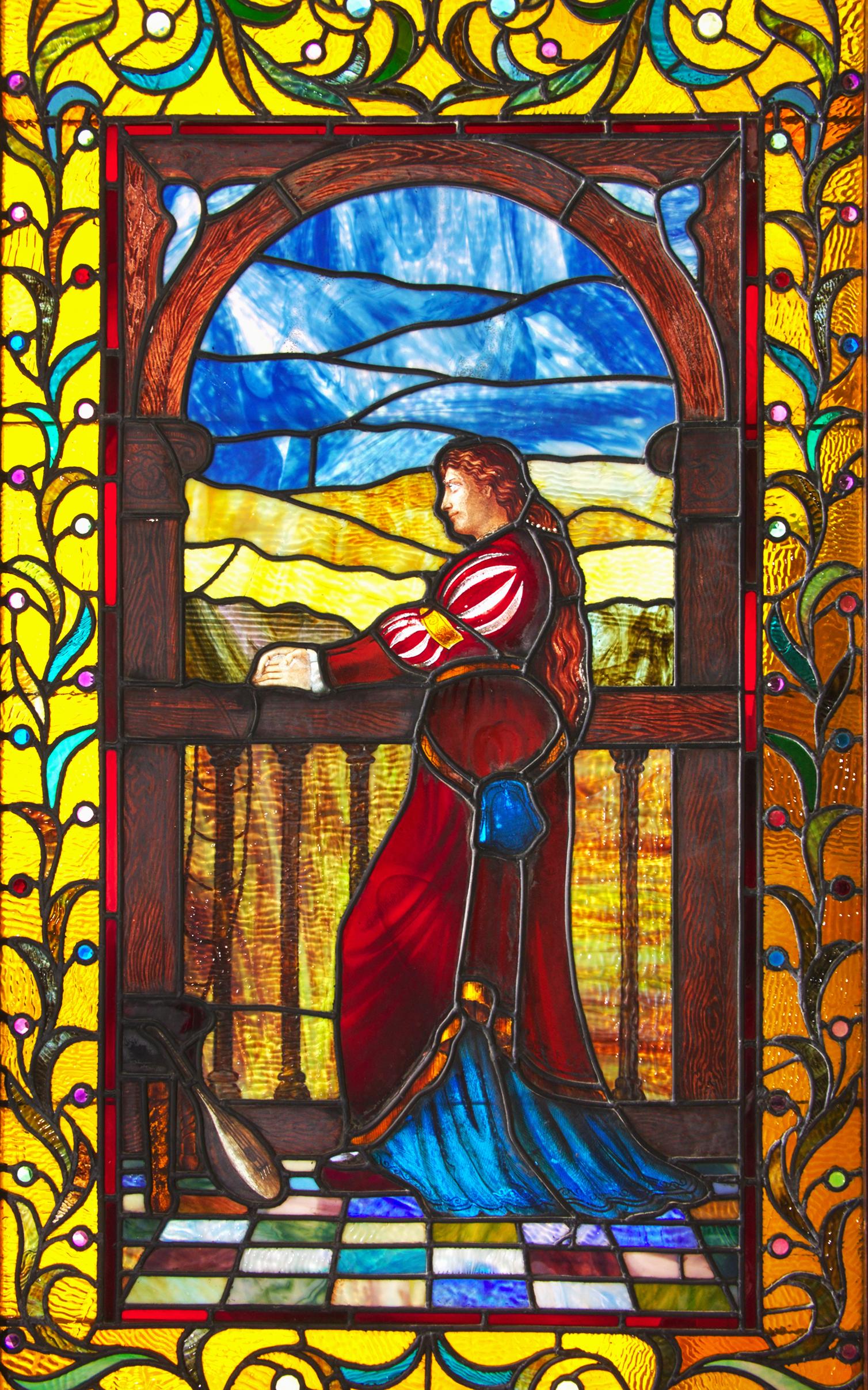 Exceptional quality stained glass panel, circa 1915, which depicts Juliet or a like maiden standing at her balcony. Incredible detail and color done by an unknown master of the art of working with glass. Condition is excellent without cracks or