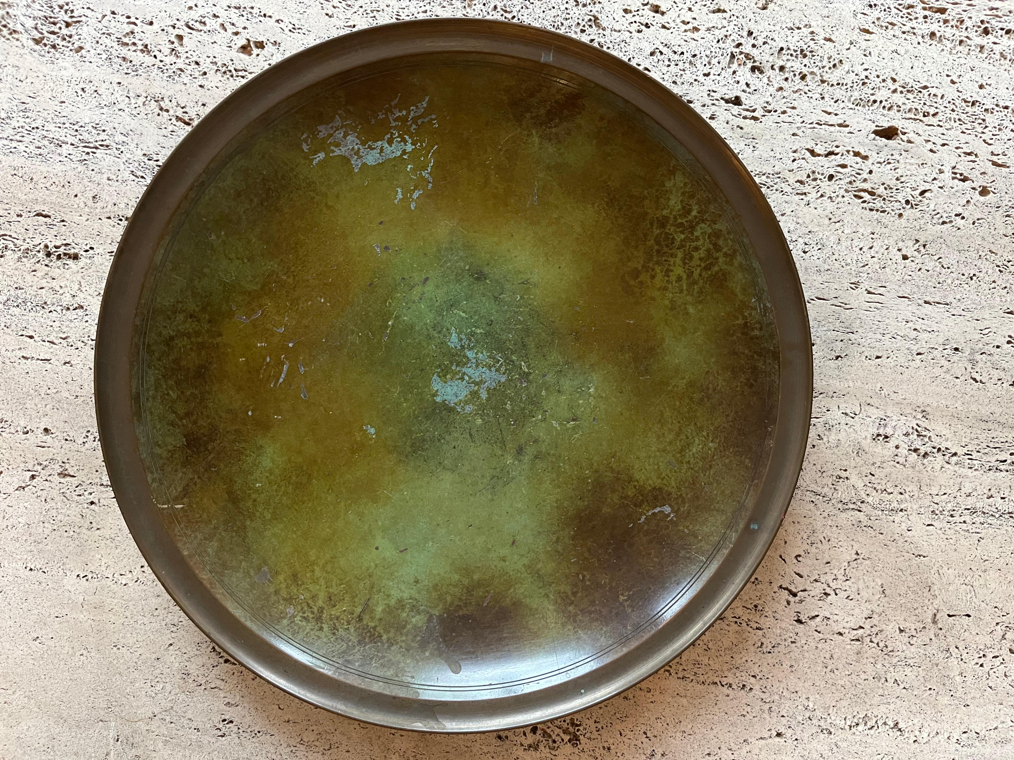 A large alloyed bronze patinated dish bowl stamped Just Andersen Denmark and numbered 1736 X. Some wear to the patination which should be visible in the photos but otherwise a larger than average example of his work. Fabulous quality.