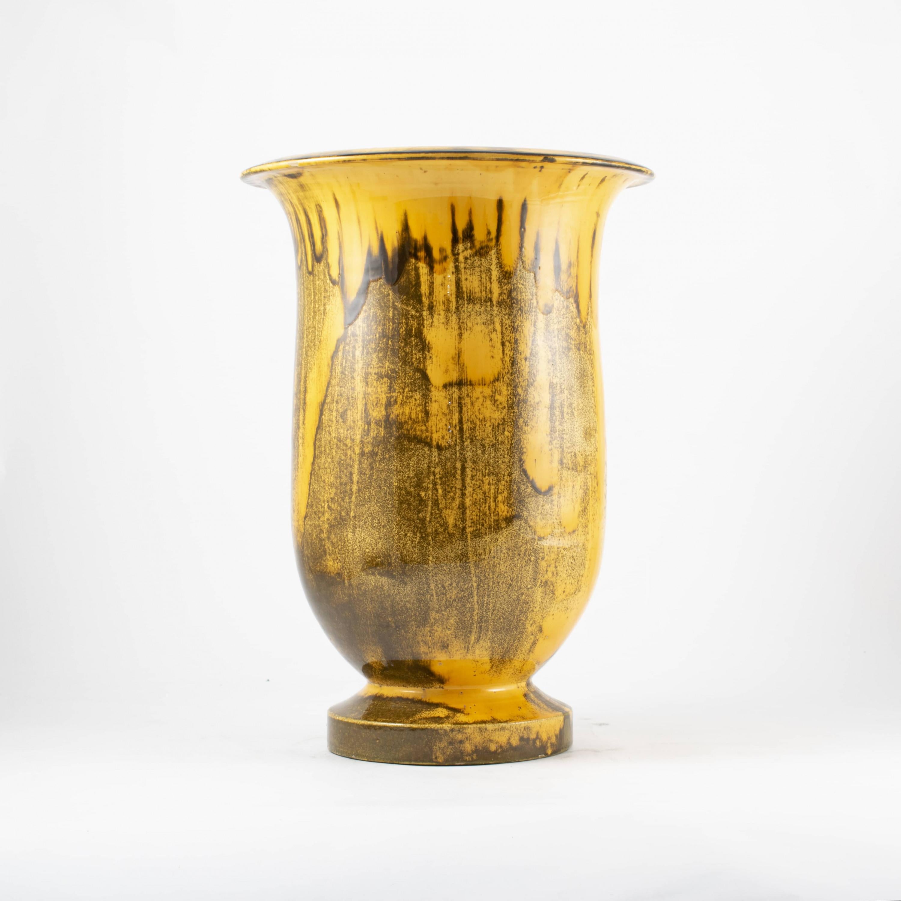 Large floor vase from Kähler with yellow / dark glaze.
Signed under bottom 