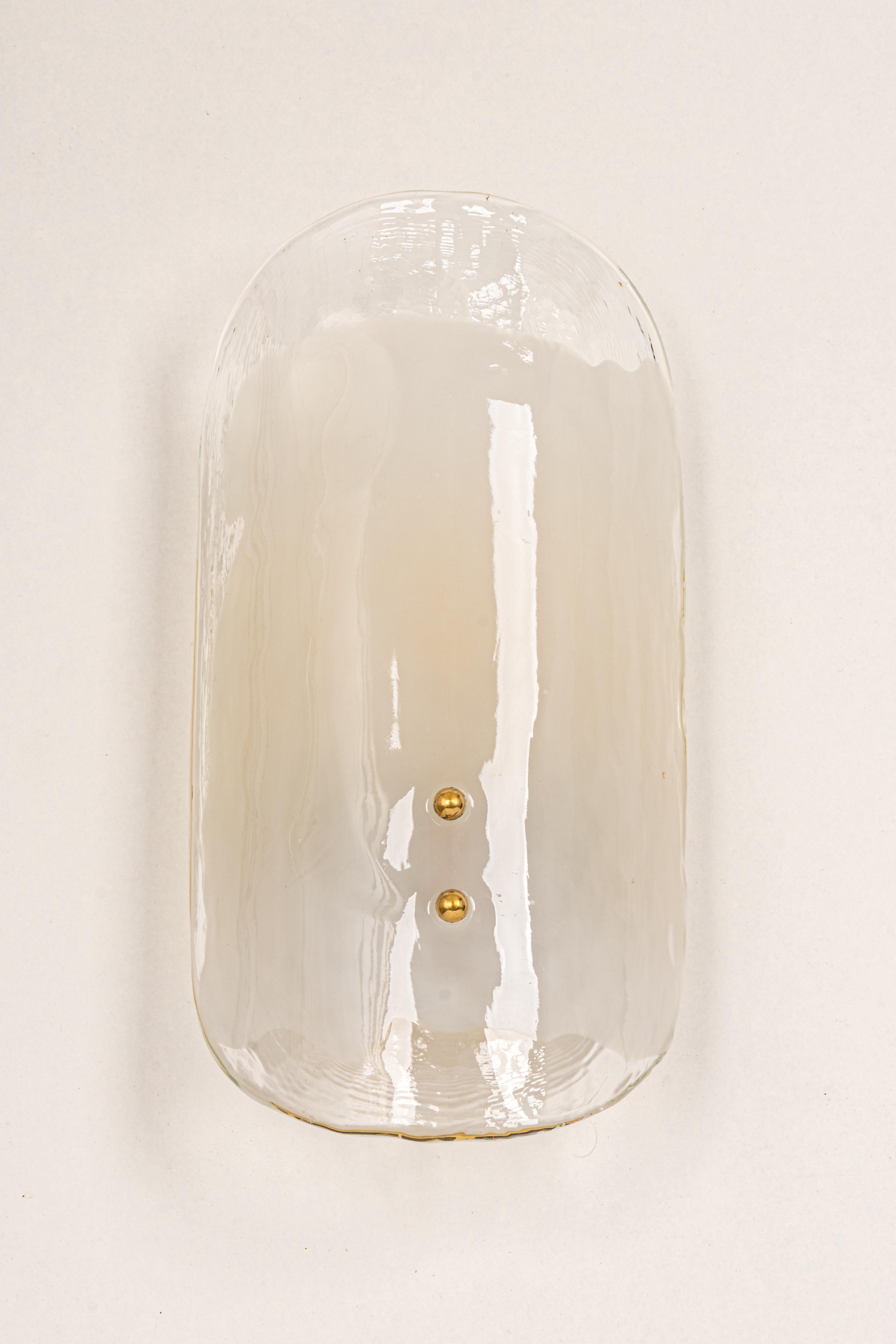 Wonderful mid-century wall sconce with murano glass, made by Kalmar, Austria, manufactured, circa 1960-1969.
High quality and in very good condition. Cleaned, well-wired, and ready to use.  

The sconce requires 2 x E14 standard bulbs with 40W
