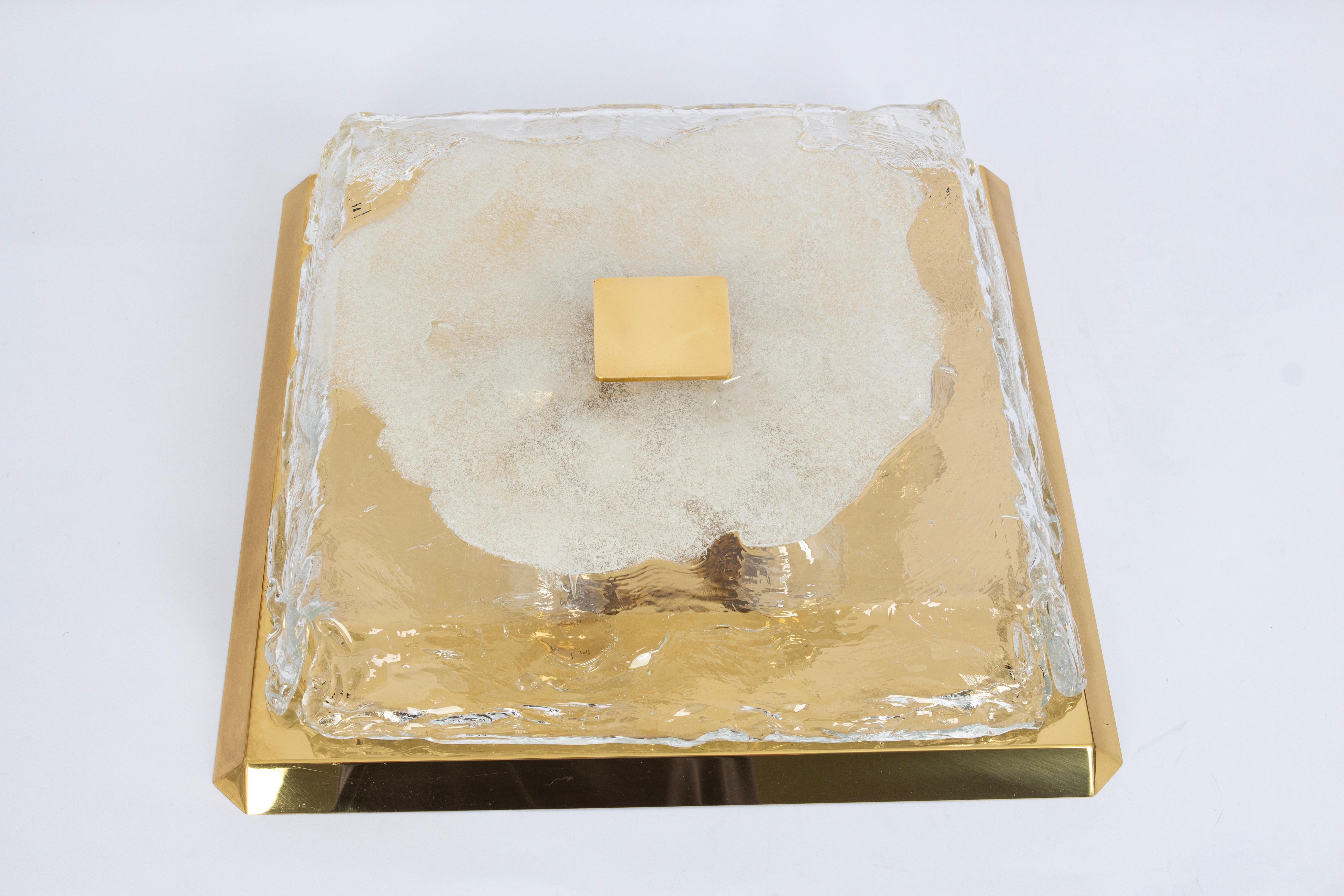 Large square flushmount ceiling light with brass backplate and hand blown Murano glass in ice melted shape by Kalmar, Austria, 1960s.
High quality of materials.

Sockets: Six x E27 standard bulbs.
Light bulbs are not included. It is possible to