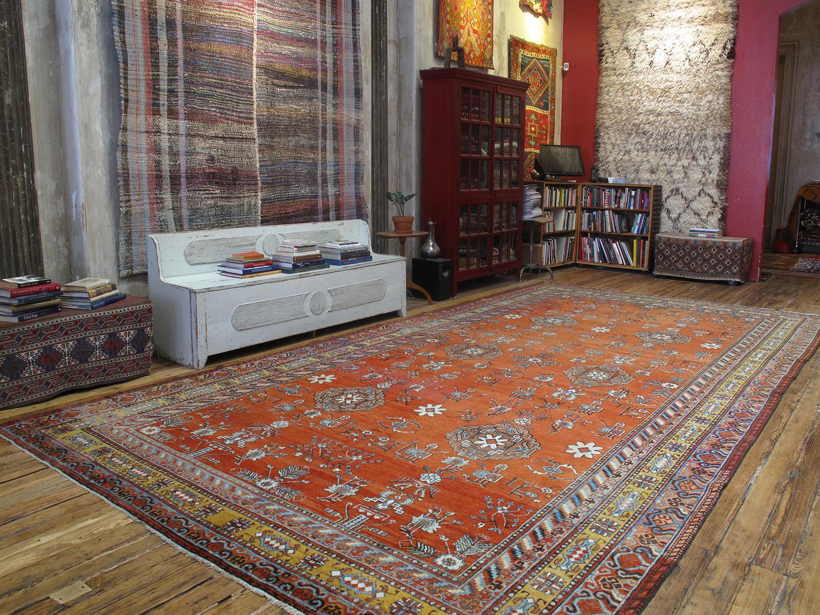 Woven in the border regions of Western China, where Chinese culture meets the Turco-Persian world of Central Asia, Khotan carpets like this feature symbols and design elements of both cultures. A very nice example of rare large proportions that