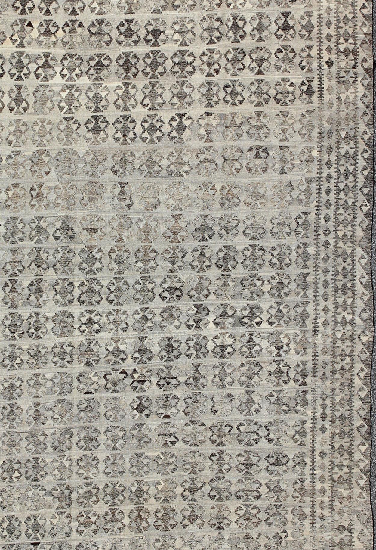 Modern Kilim for modern and casual interiors. Keivan Woven Arts, Rug/ABT-8122742, Afghan Kilim Rug in dark gray, silver and gray, origin/ Afghanistan Circa / 2010

Measures:10' x 16'3 

This hand-woven Afghan kilim rug features a beautiful all