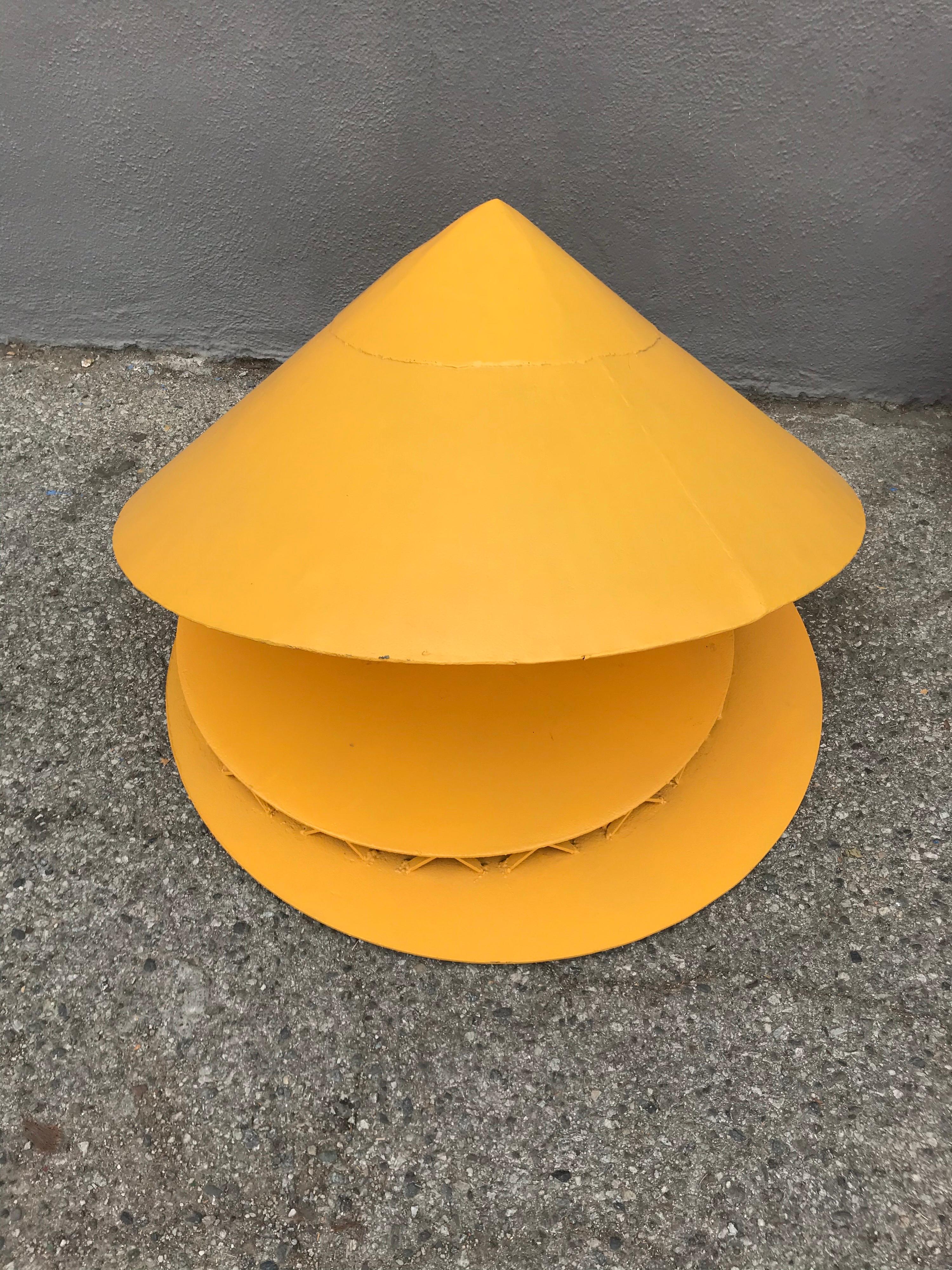 Fun piece of modern art 
There is a solid weighted steel ball inside the saucer that keeps it balanced around the platform.
It will rotate lazily two or three times on the base by pushing it with both hands atop the point.
It has a great scale for a