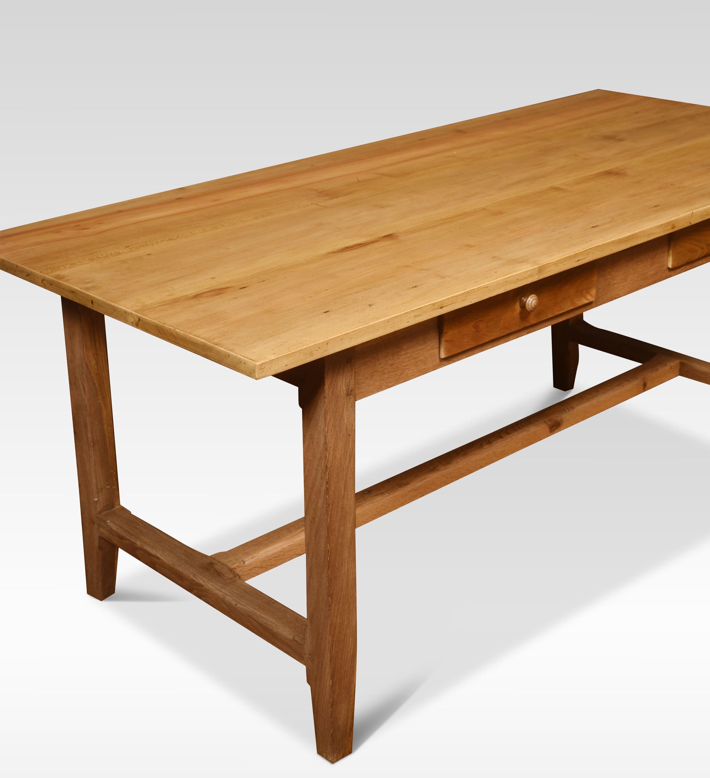 Large kitchen dining refectory table, the large rectangular top above a shallow frieze fitted with two drawers. All raised up on four square tapered legs united by stretcher.
Dimensions
Height 29 inches
Width 69 inches
Depth 31 inches.