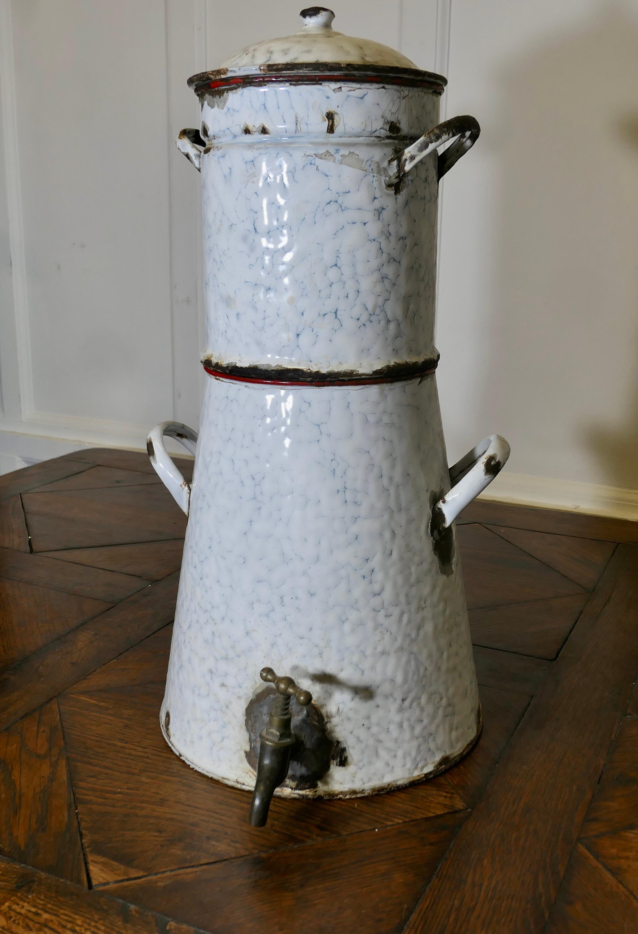 Large Kitchen Range Enamel Coffee Urn Samovar

This very ancient and much used piece, it is a 2 piece coffee percolator with a strainer and lid and at the bottom it has a brass tap 
In very well used condition, but still ideal for display or quirky