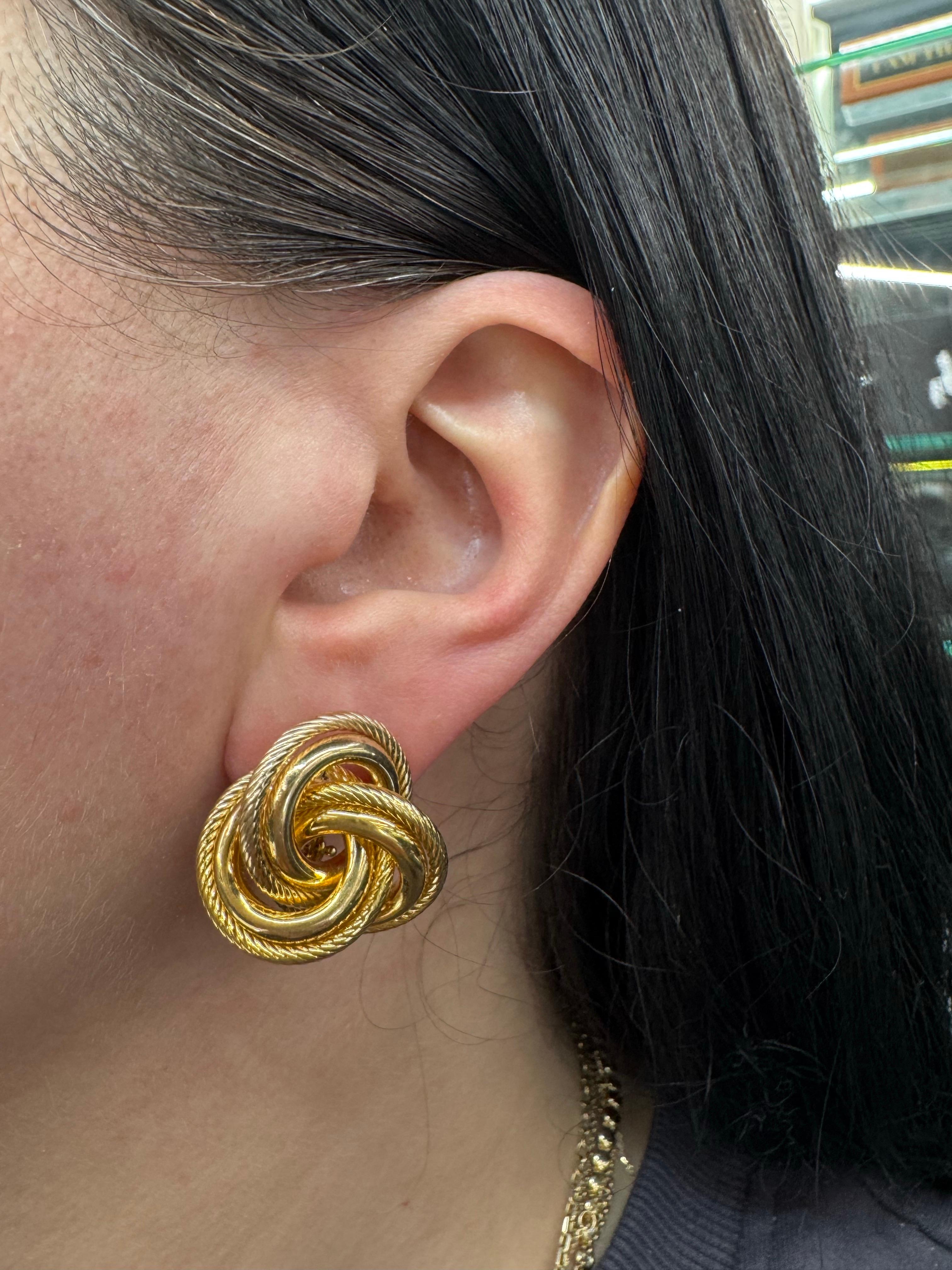 14 Karat yellow gold stud earring featuring a large knotted motif with high polish and braided style weighing 16.2 grams. 
