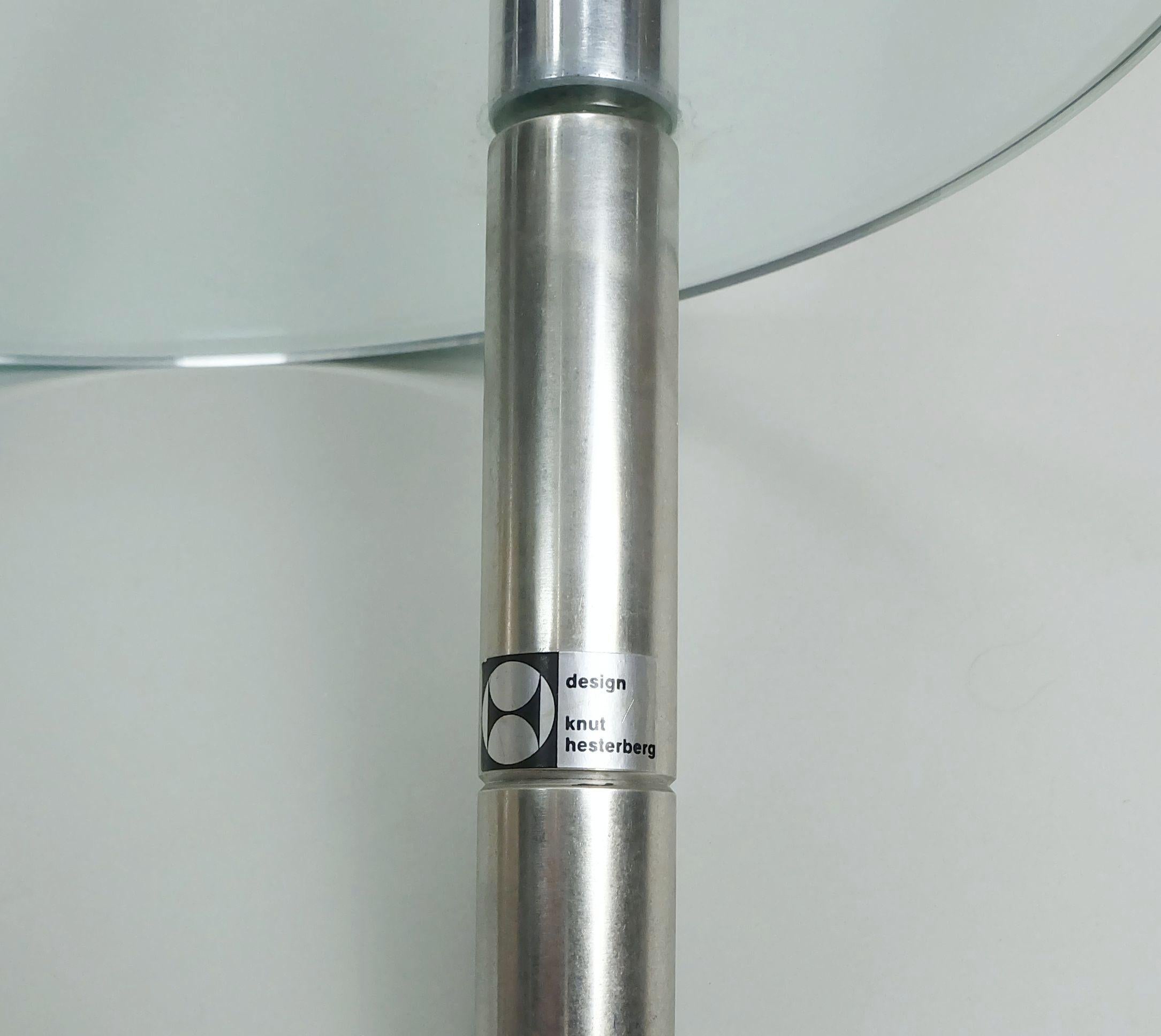 Very rare large candle holder from the 1970s. It consists of 3 stainless steel tubes which are connected to each other by a round glass disc. For large candles up to 4.3