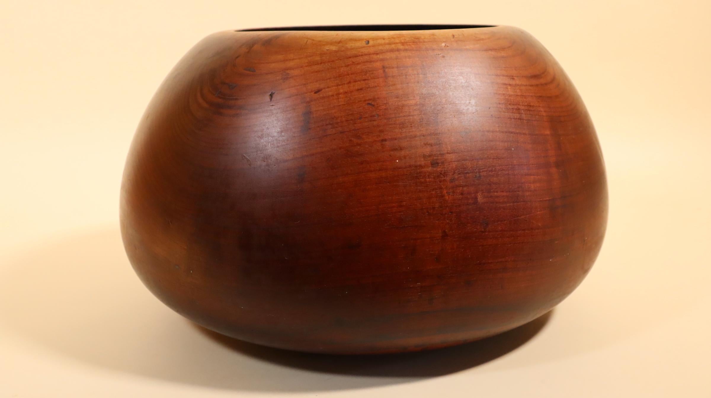 Very large teak wood salad or serving bowl. Origin not known. One piece of wood, not laminated.  Probably Northern European, Scandinavian, Finland?
Measures 9 inches high and outside dimensions are 15 x 16 inches.
It shows wear and patina from
