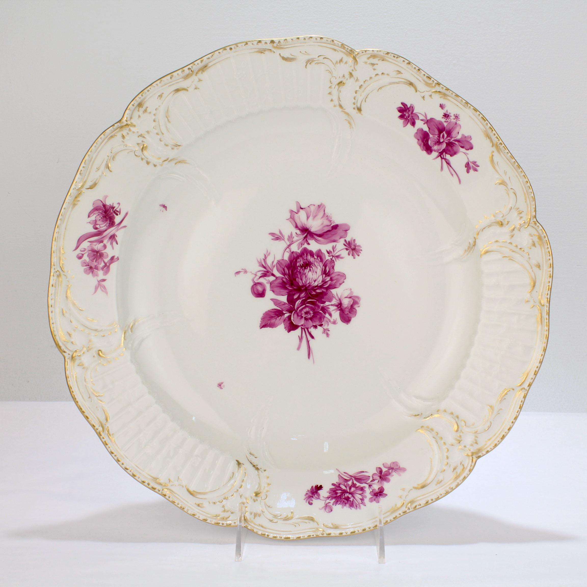A very fine, large porcelain charger in the Reliefzierat pattern. 

By the K.P.M. Royal Berlin Porcelain Manufactory. 

Modeled after the services supplied to Frederick the Great of Prussia for his Potsdam palace.

With a large hand-painted