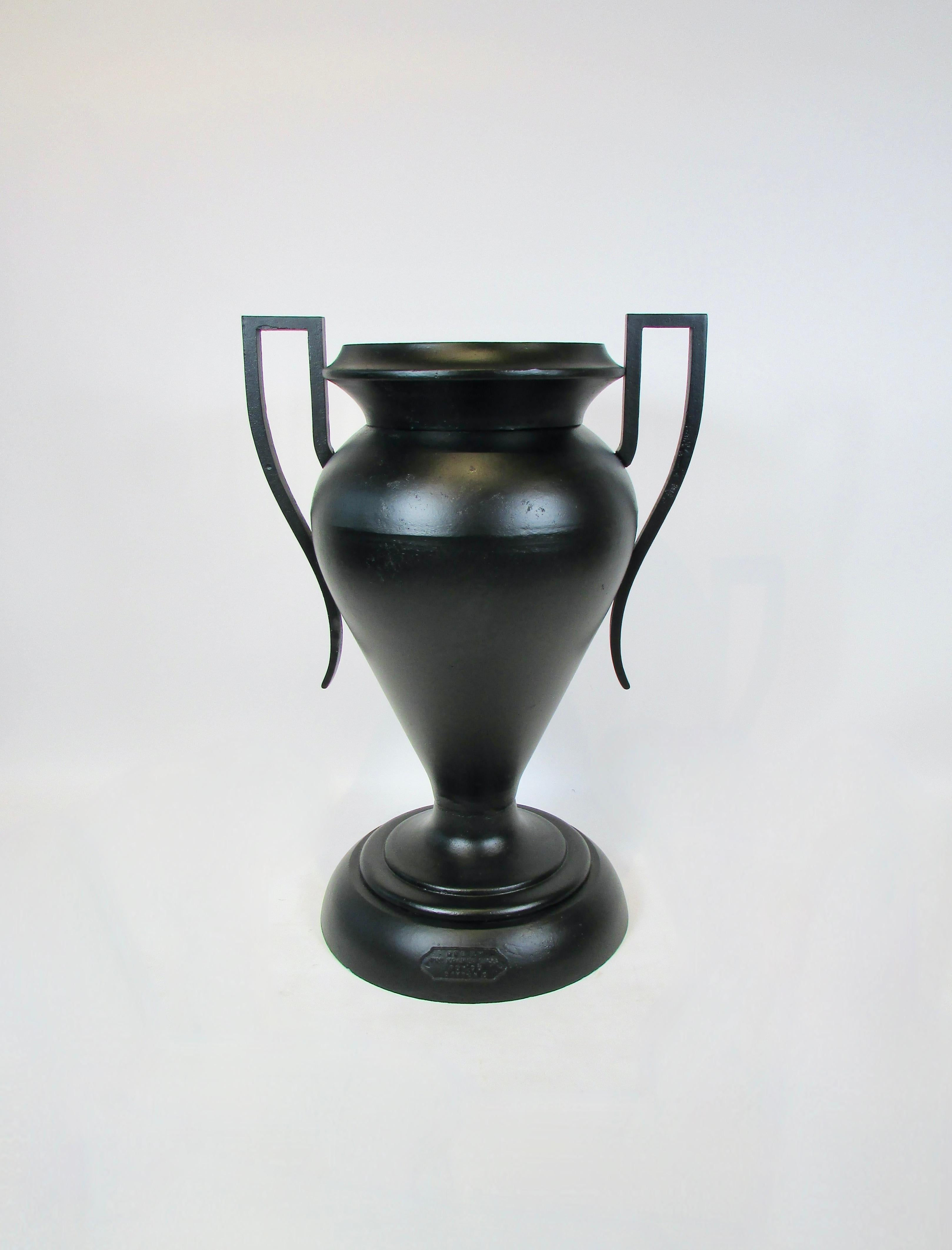 Monumental Kramer Brothers planter urn. Produced in three pieces base, main body and planter insert. Each piece media blasted and powder coated in Matte black finish. Measures 28