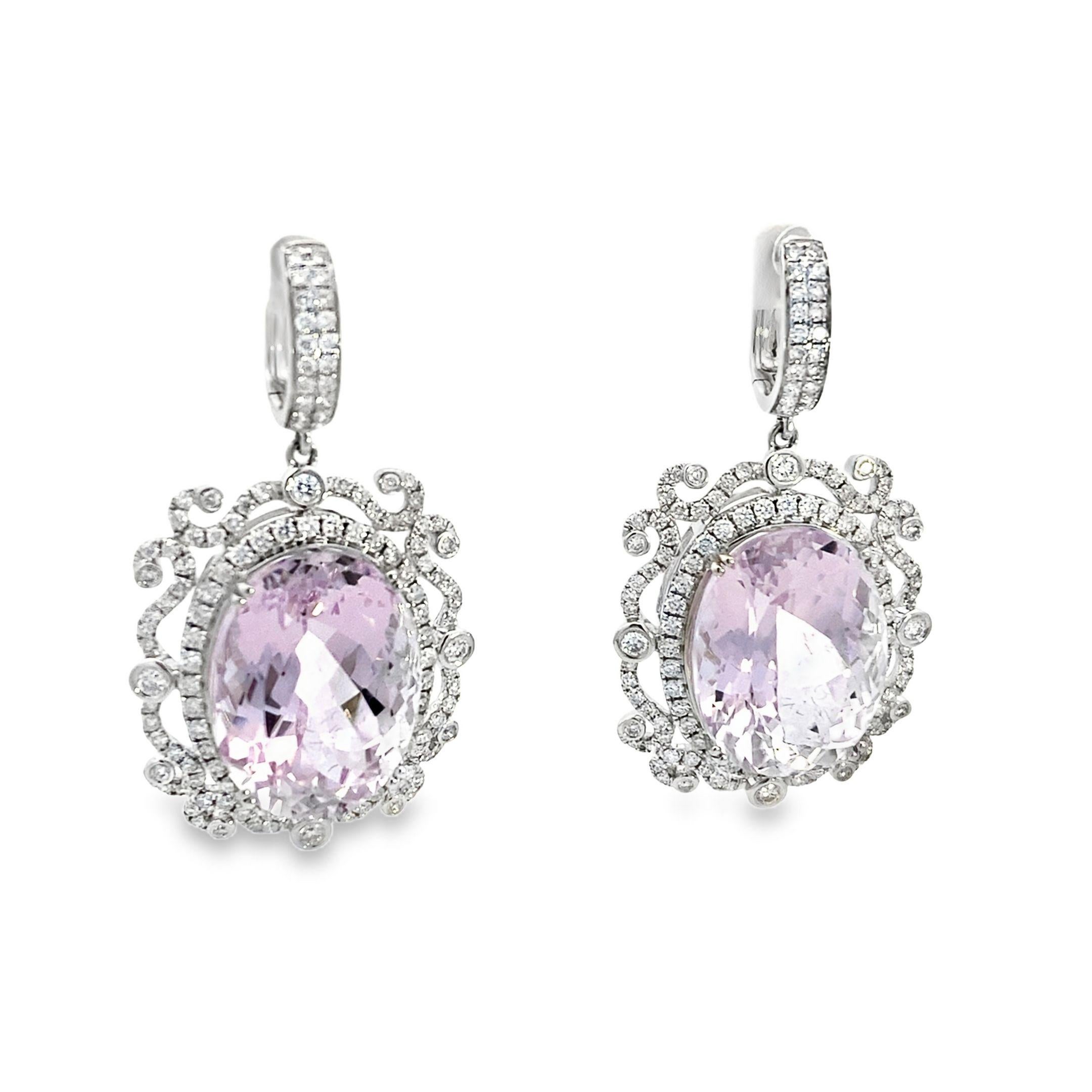 This pair of classic and traditional 18k white gold earrings exudes elegance and sophistication. The focal point of these stunning earrings is the breathtaking 47.51 carat pink oval Kunzite gemstone, prong-set to showcase its vibrant hue and sheer