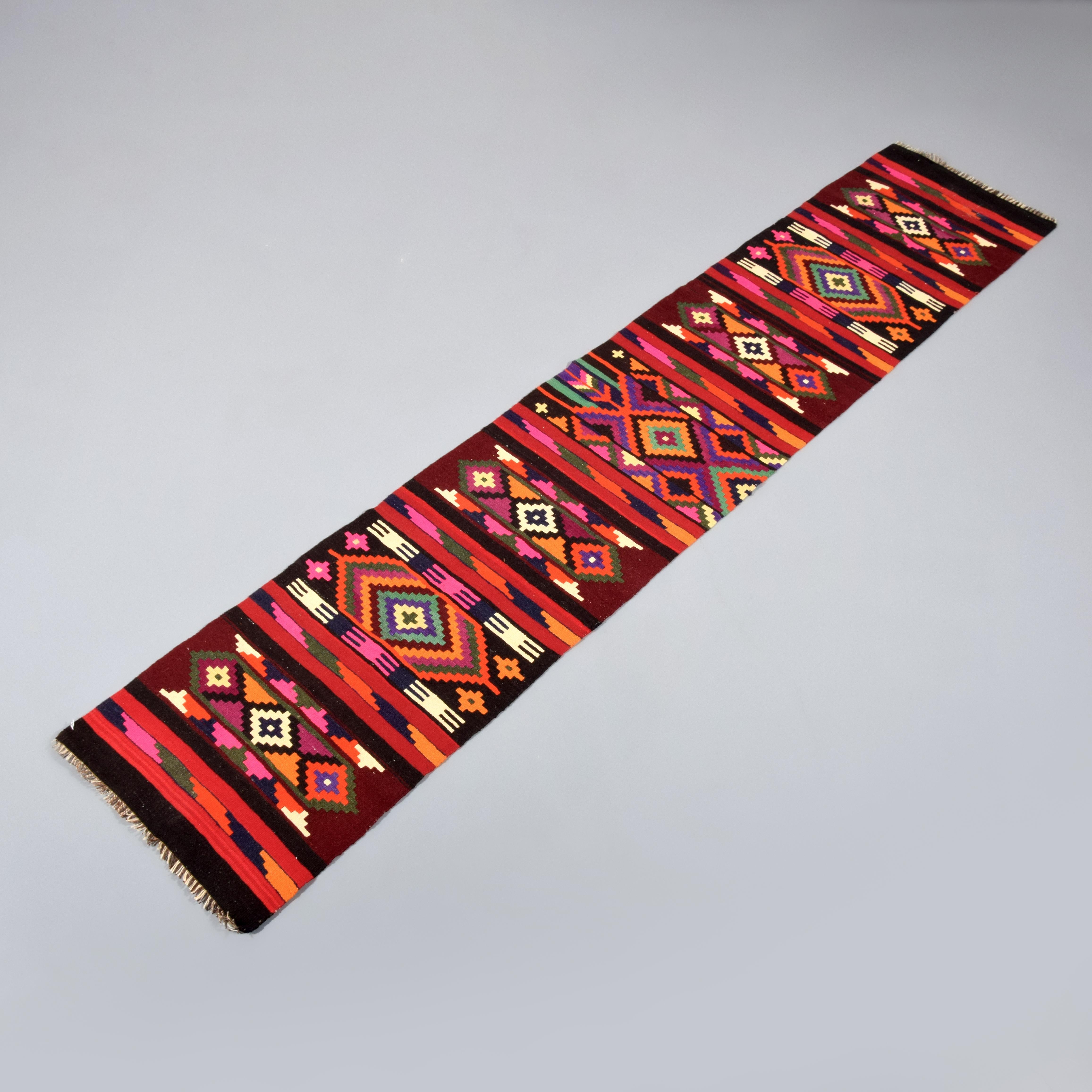 Additional Information: Kurdish village runner made for home use, a rare find in the big city bazaars. Flat woven rug has traditional, local bold patterns and colors. Kurdish people use bright colors like pink and orange to ward off the Evil Eye.