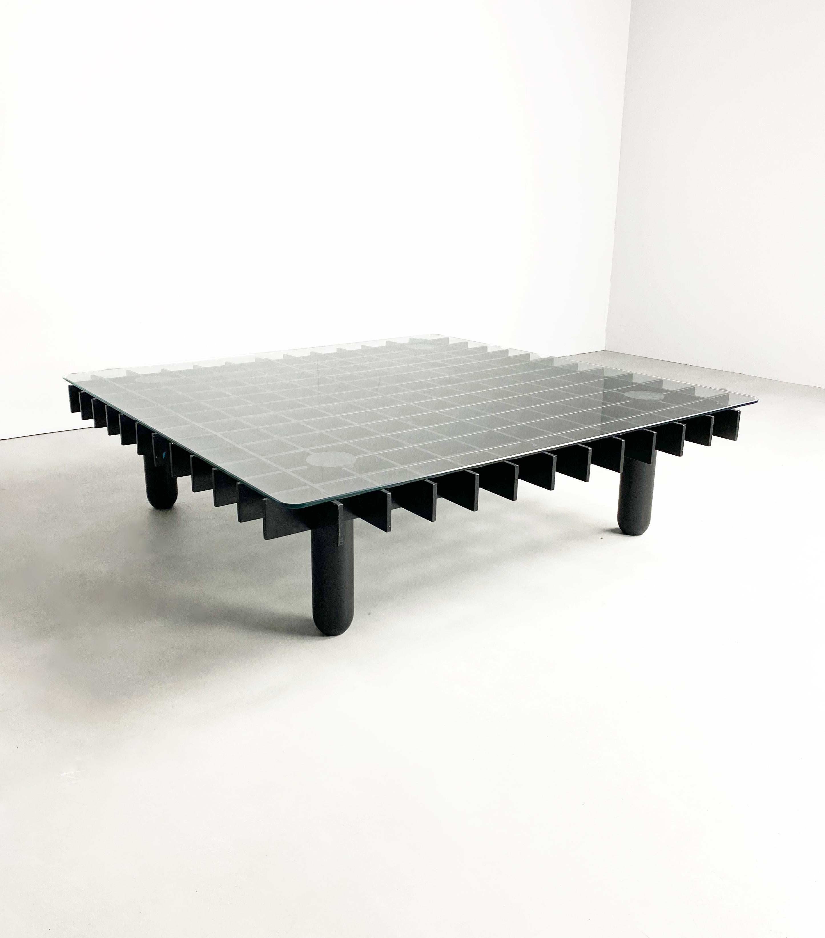Large graphical coffee table attributed to Gianfranco Frattini and as manufactured and distributed in a limited run by Knoll and Pierluigi Ghianda in the 1970's.

The grid shaped base is formed from black lacquered beech, it's construction