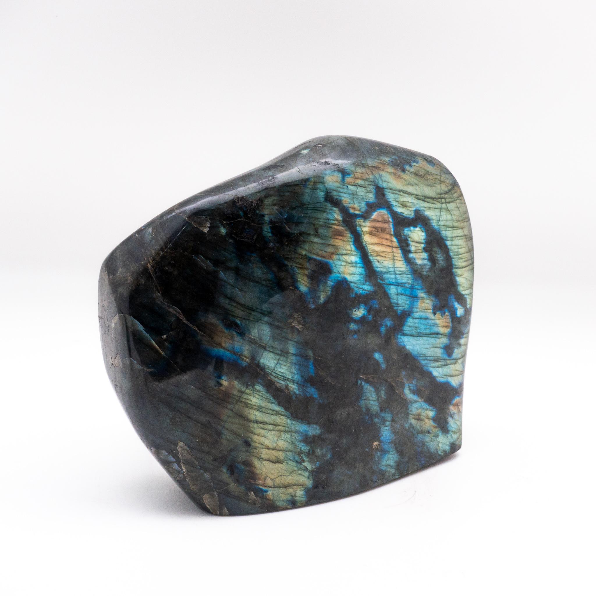 Large polished labradorite specimen. Labradorite displays an iridescent optical effect (or schiller) known as labradorescence. Labradorite is also know as stone that will help you become the person that you are destined to be. It will cleanse your