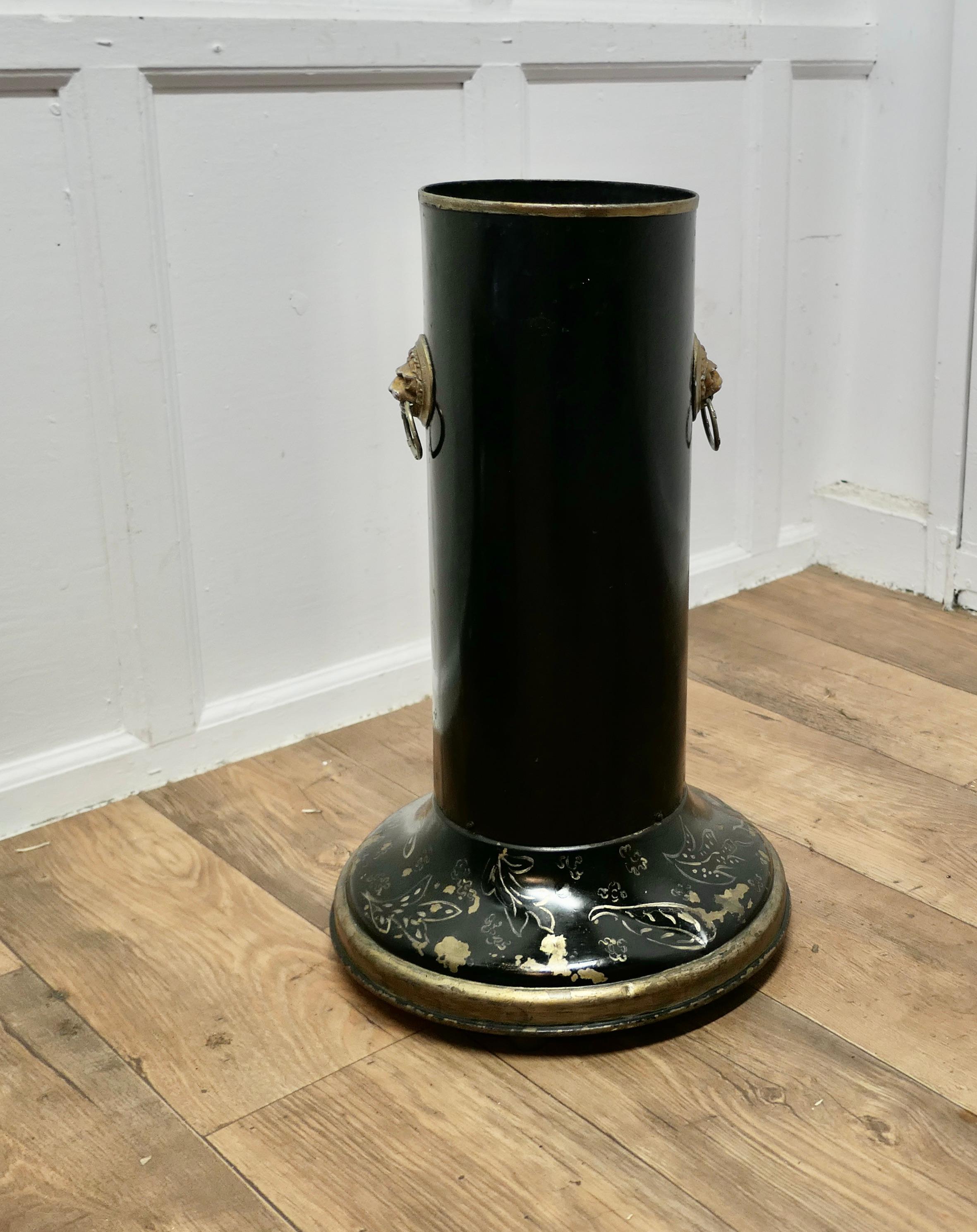 Large Lacquered Metal Stick Stand, Umbrella Stand

This  good looking piece is tall with black and gold Lacquer, with a wide heavy base and 2 lions mask handles 

The Stick stand is in good condition, it is 25” high and 8”  in diameter at the top