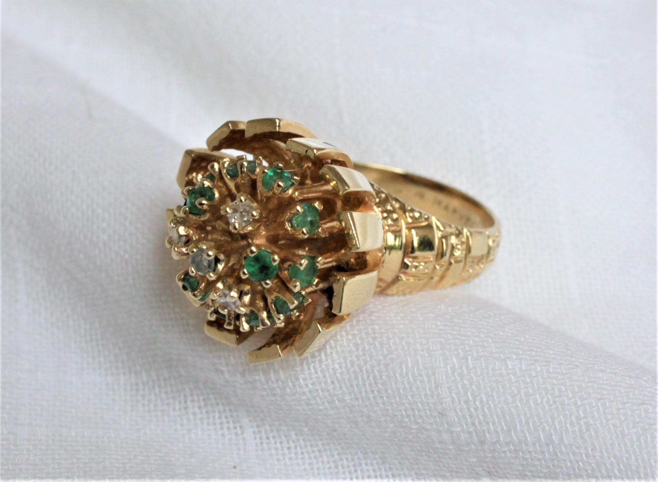This very substantial ladies yellow gold cocktail ring is presumed to have been made in the United States during the 1960s in a midcentury style. The ring is stamped 14-karat and features 4 single cut and prong set diamonds which are layered in