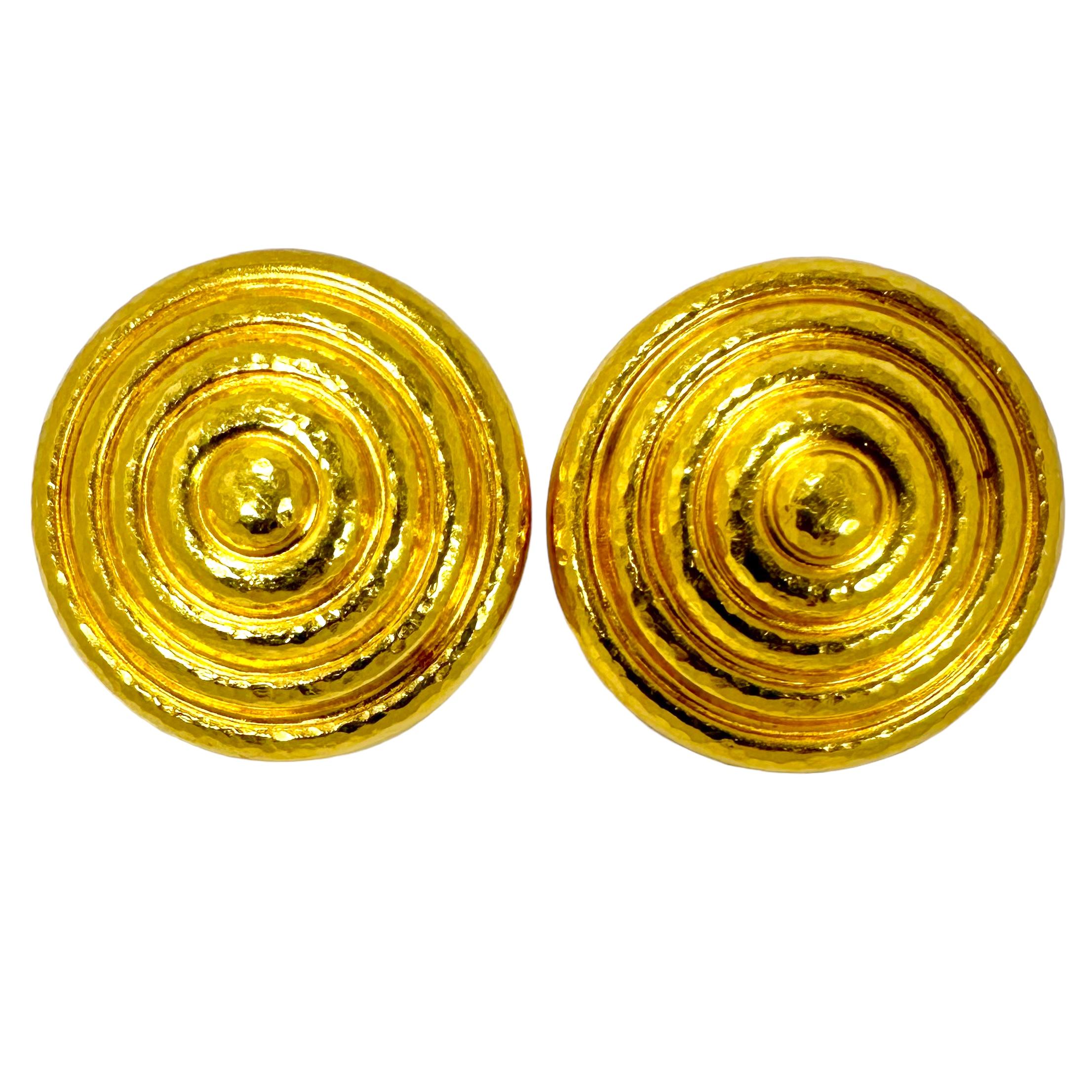 Expertly fashioned in 18K yellow gold by Greek designer Ilias Lalaounis,
with a lightly hammered finish all over, that is a trademark of the workshop's fine quality. The large scale of this particular pair is sure to make them a statement piece,