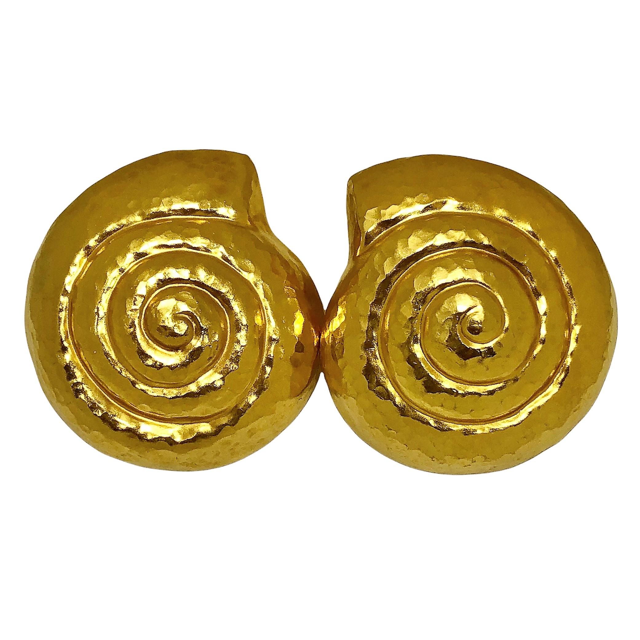 This pair of 22k yellow gold Lalaounis Nautilus shell motif earrings are hand hammered over their entire front and rear surface, and come equipped with clip backs. They are quite large, measuring 
1 1/2 inches by 1 3/8 inches in diameter and are