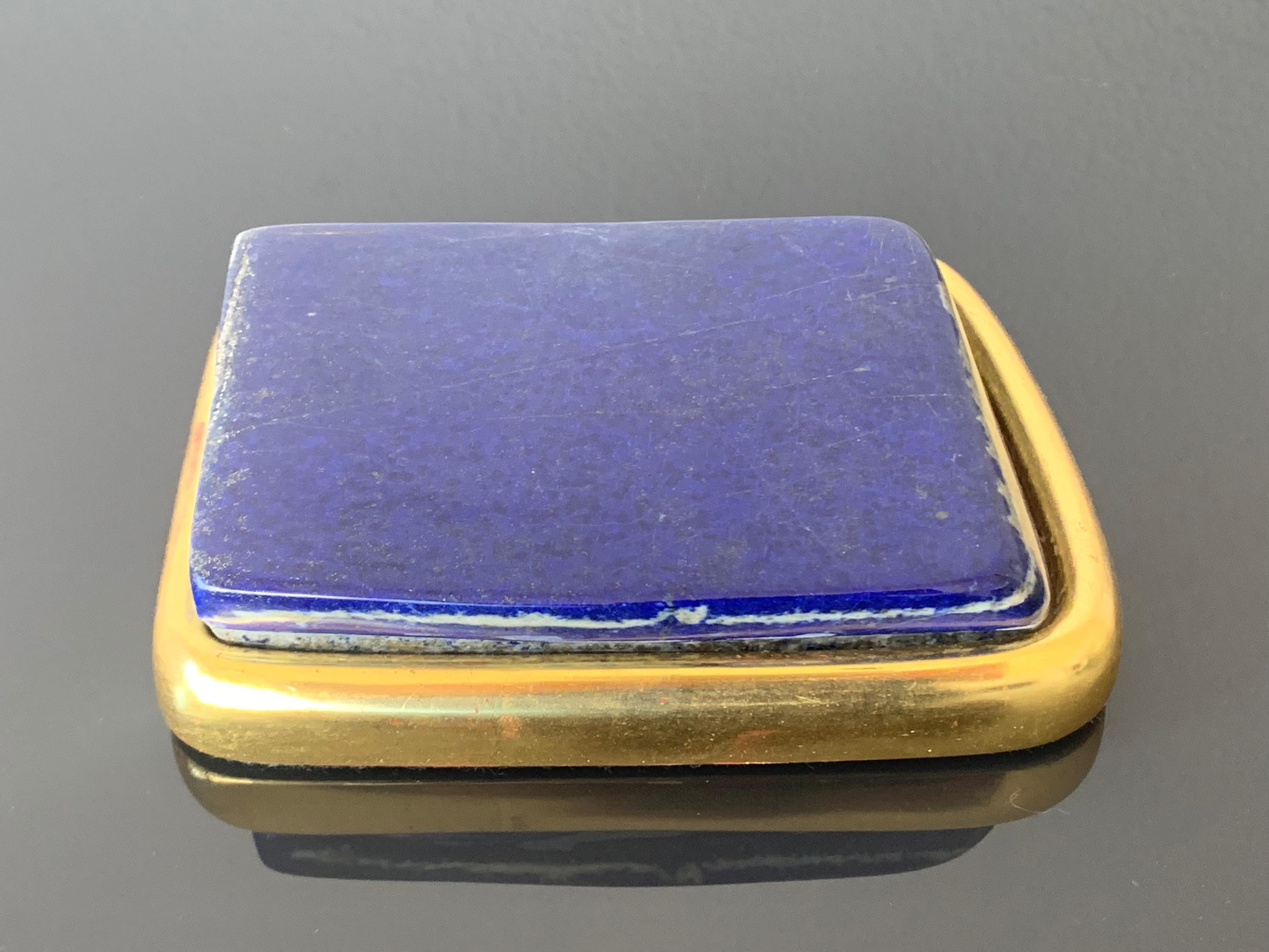 Large lapis lazuli paperweight in 22-karat gold leaf setting.