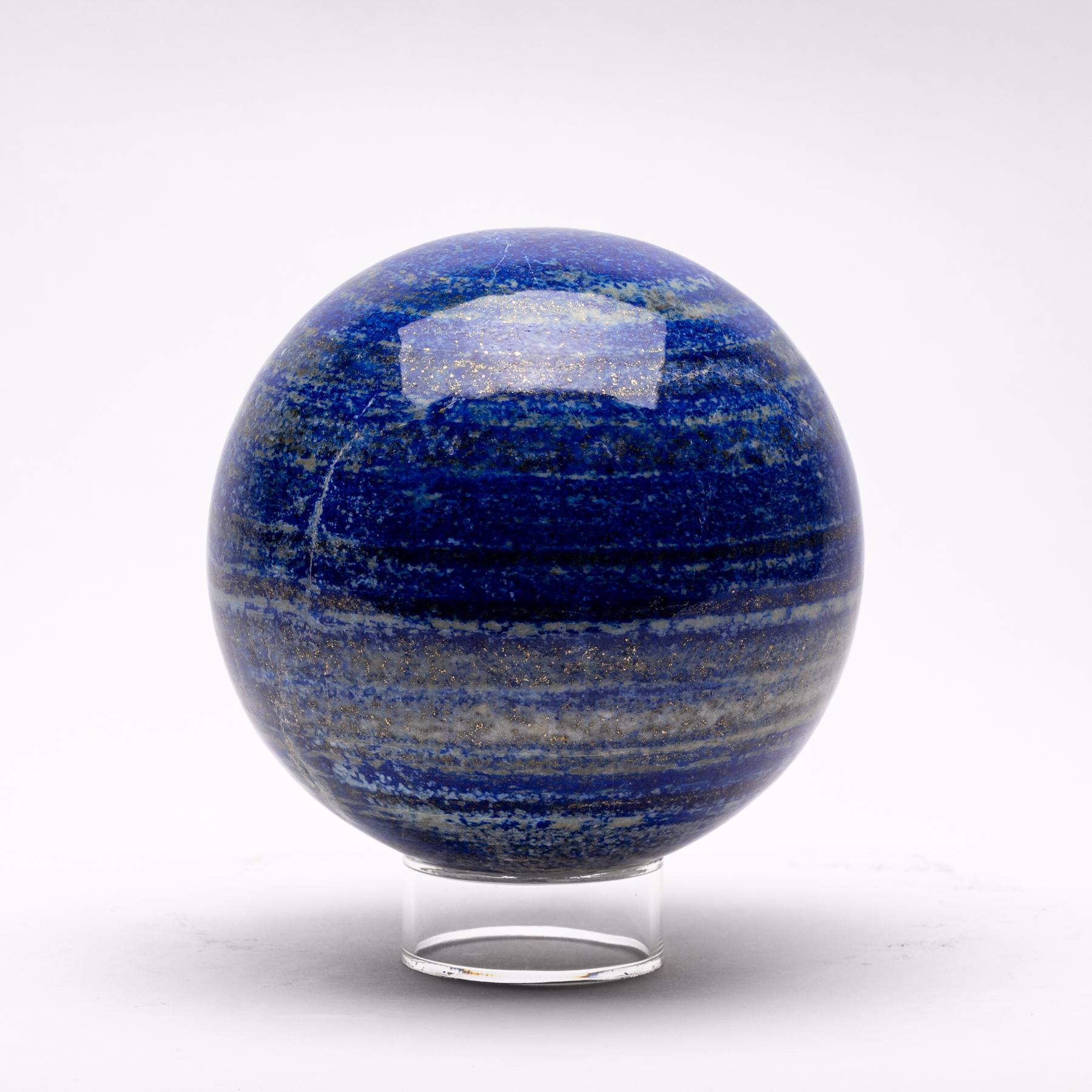 This beautiful large lapis lazuli sphere from Afghanistan features outstanding hues of blue, gold, and white.