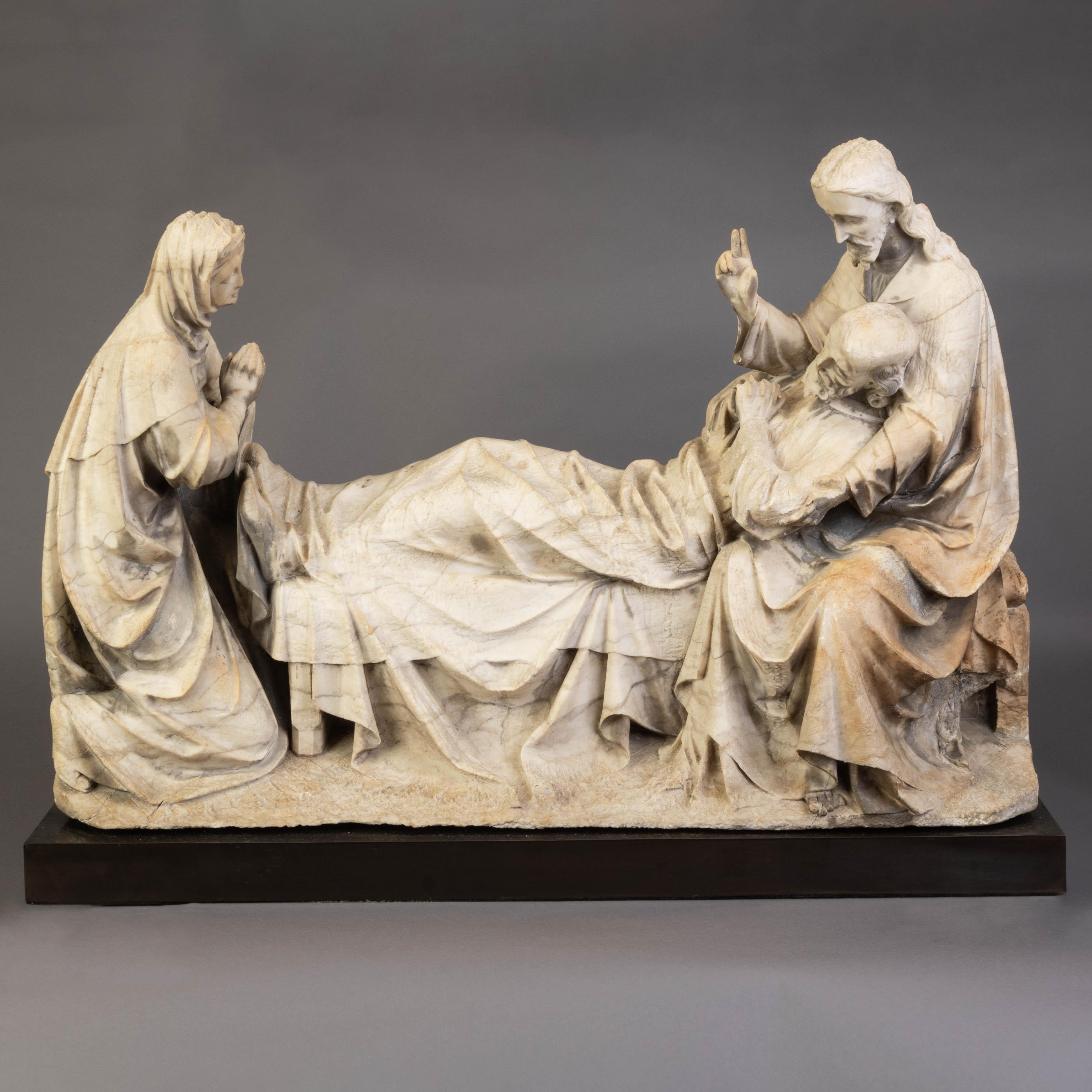 Un grand et rare groupe de sculptures religieuses en marbre de la seconde moitié du XVe siècle, sculpté à la main, monté sur une base en bronze pour être exposé. Ce groupe de sculptures représente la mort de saint Joseph avec le Christ et