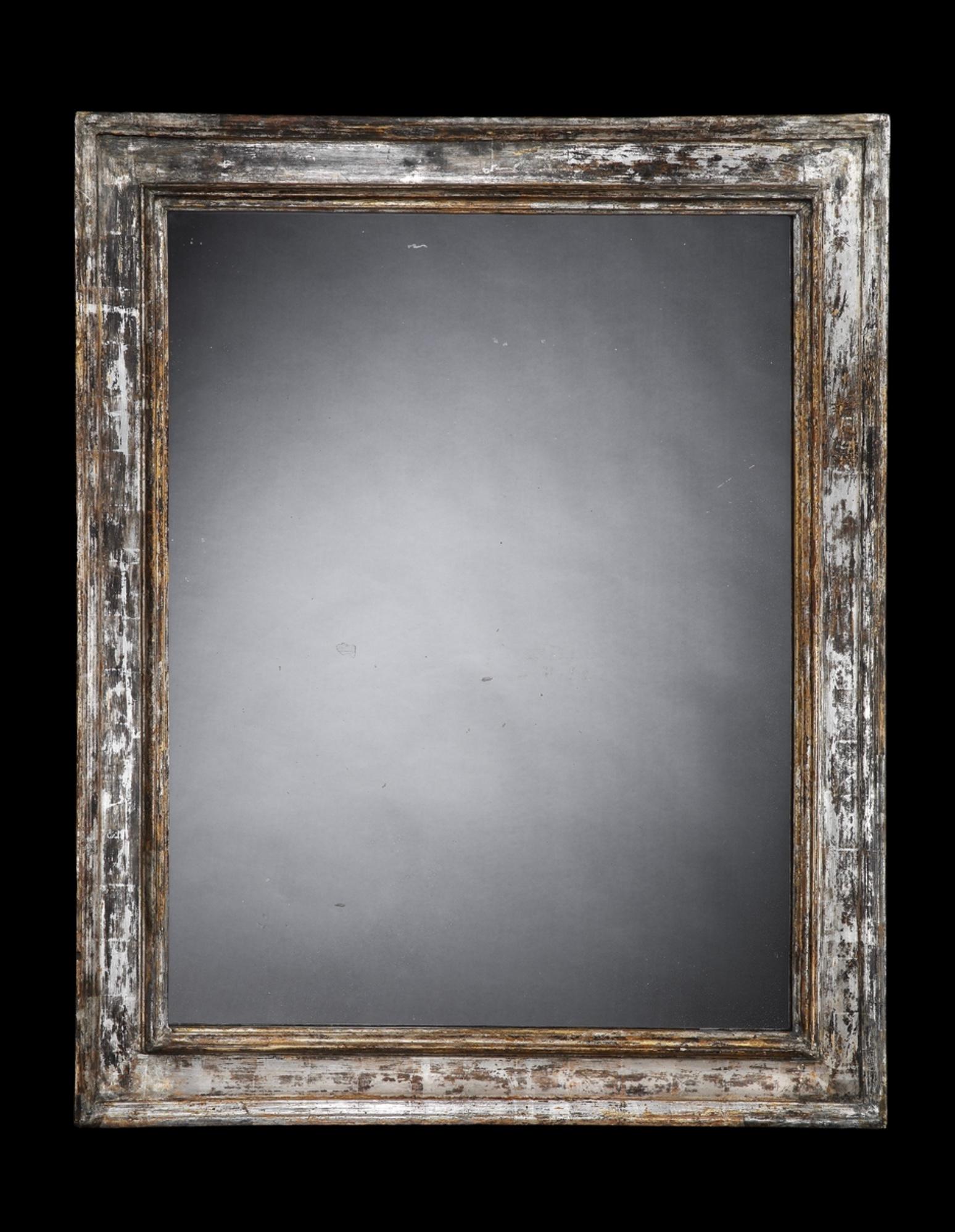 A  very fine large late 17th early 18th century Italian silver leaf rectangular frame with moulded relief detailing,
holding a fine antique mirror plate with lovely sparkle.