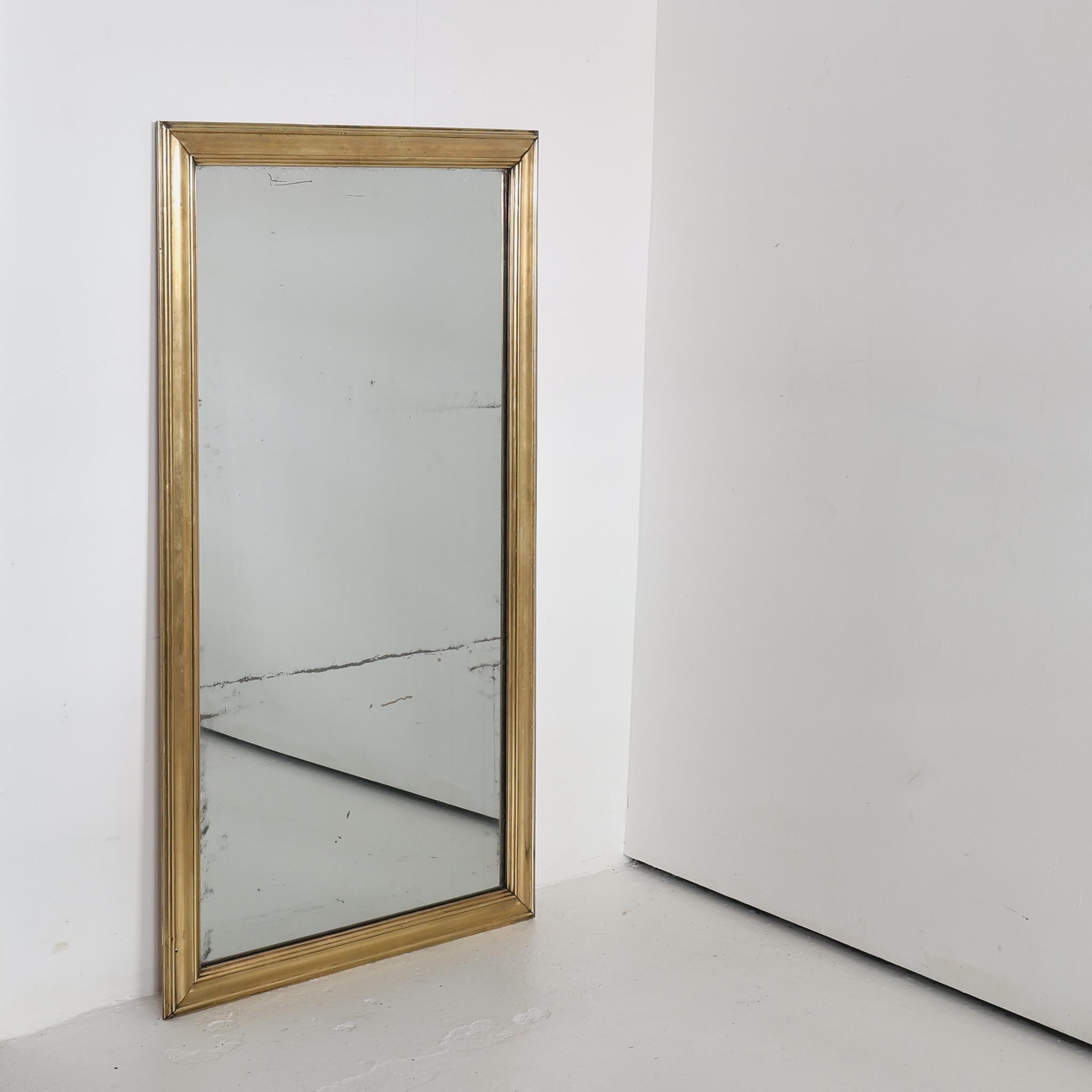 A large late 19th C. Lyonnais brass bistro mirror

Original foxed mercury glass mirror plate.

Recently replaced back board.