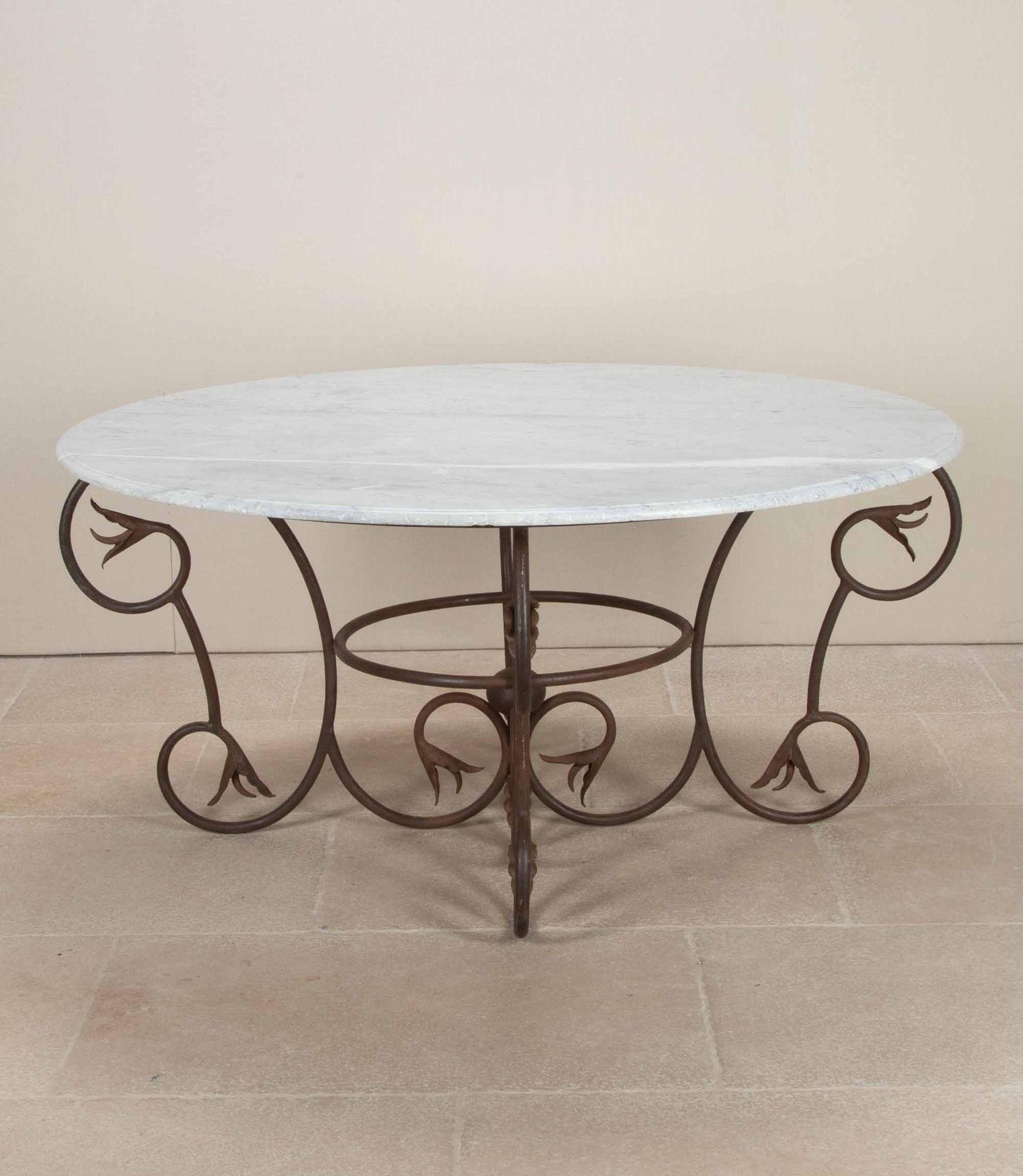 Large late 19th Century French Art Nouveau wrought iron and moulded edge marble top table. Superb patina to the iron base, Circa 1890.