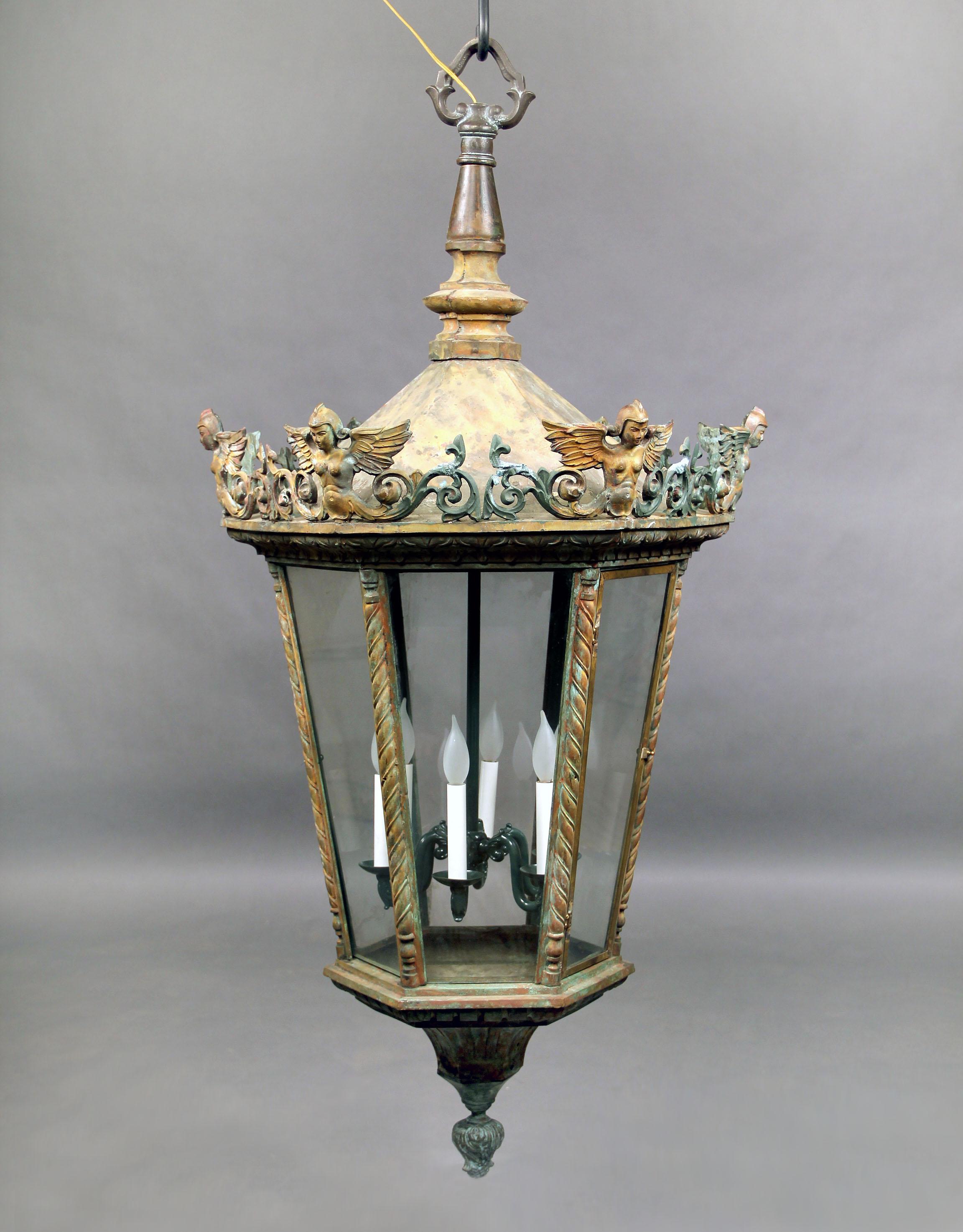 A large late 19th century bronze six light street lantern.

Of hexagonal form with winged mythological figures.

 