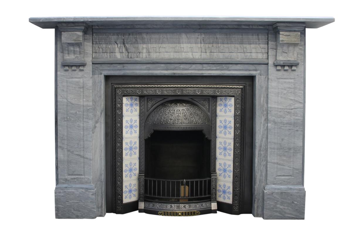Large late 19th century fire surround in Bardiglio grey marble. The frieze is decorated with dentil moulding flanked by geometric corbels supporting the shelf above further pronounced dentil moulding and flutes to the jambs, circa 1880.
Pictured