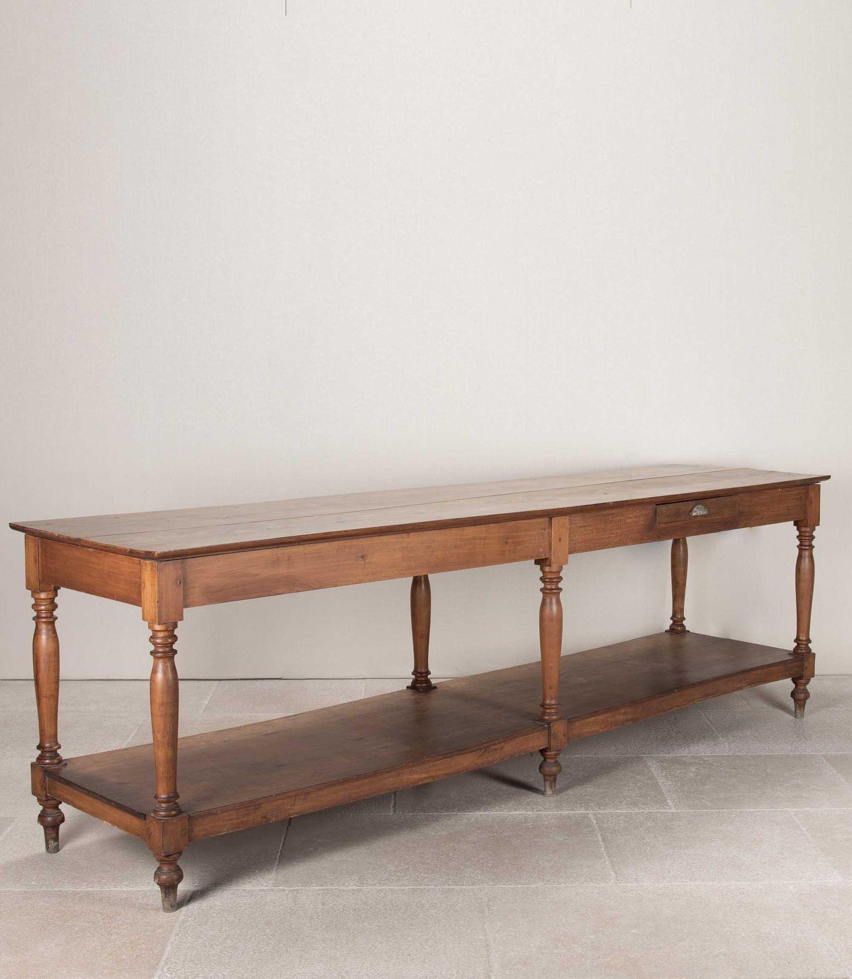 Good size late 19th Century French draper’s table.With a single drawer and six turned legs. Perfect for the kitchen or long hallway. Circa 1880.