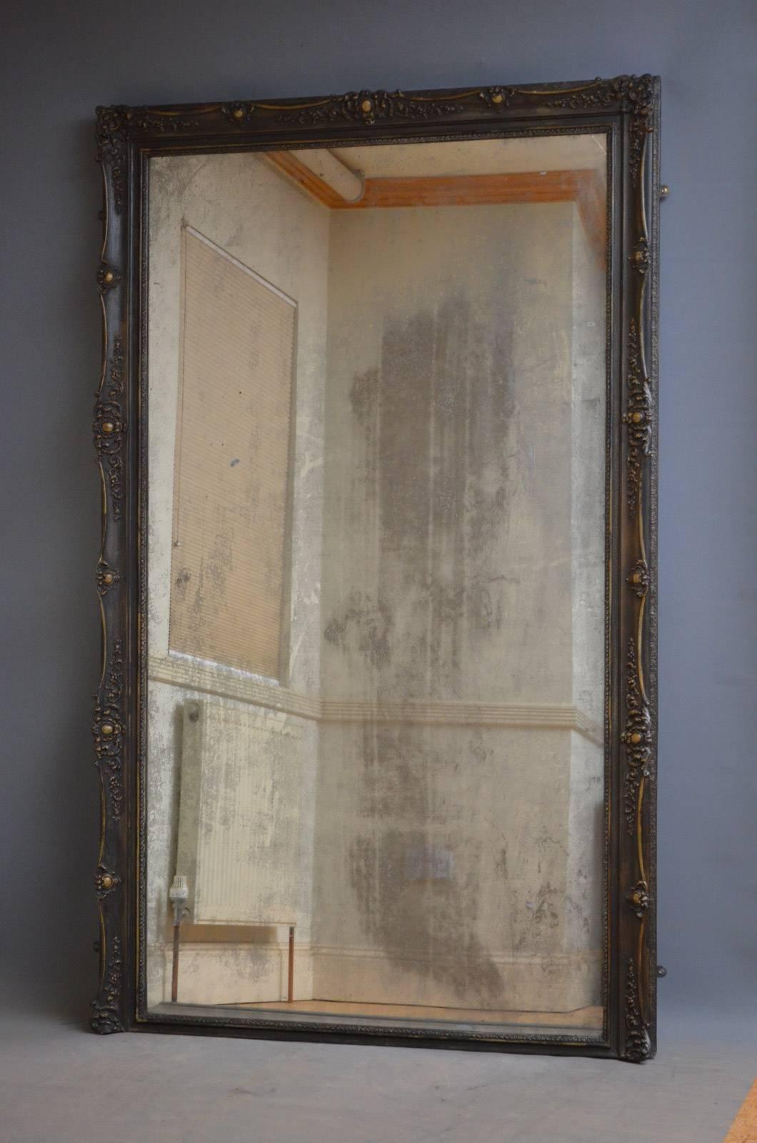 Sn4324 large late 19th century French floor standing mirror, having original mirror plate with excellent foxing and silvering throughout in finely carved frame. The glass has a small crack to top right corner but having aged so beautifully we