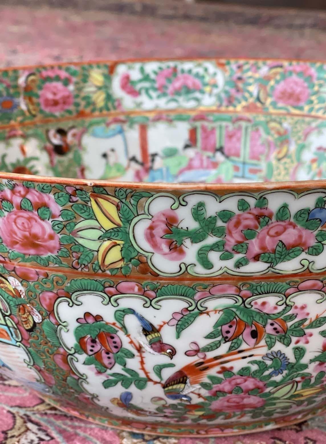 Large Rose Medallion Chinese Export bowl from the late 19th century.
Surrounded by classical oriental scenes around the outside and within the centre. 
Dimensions:
5.75