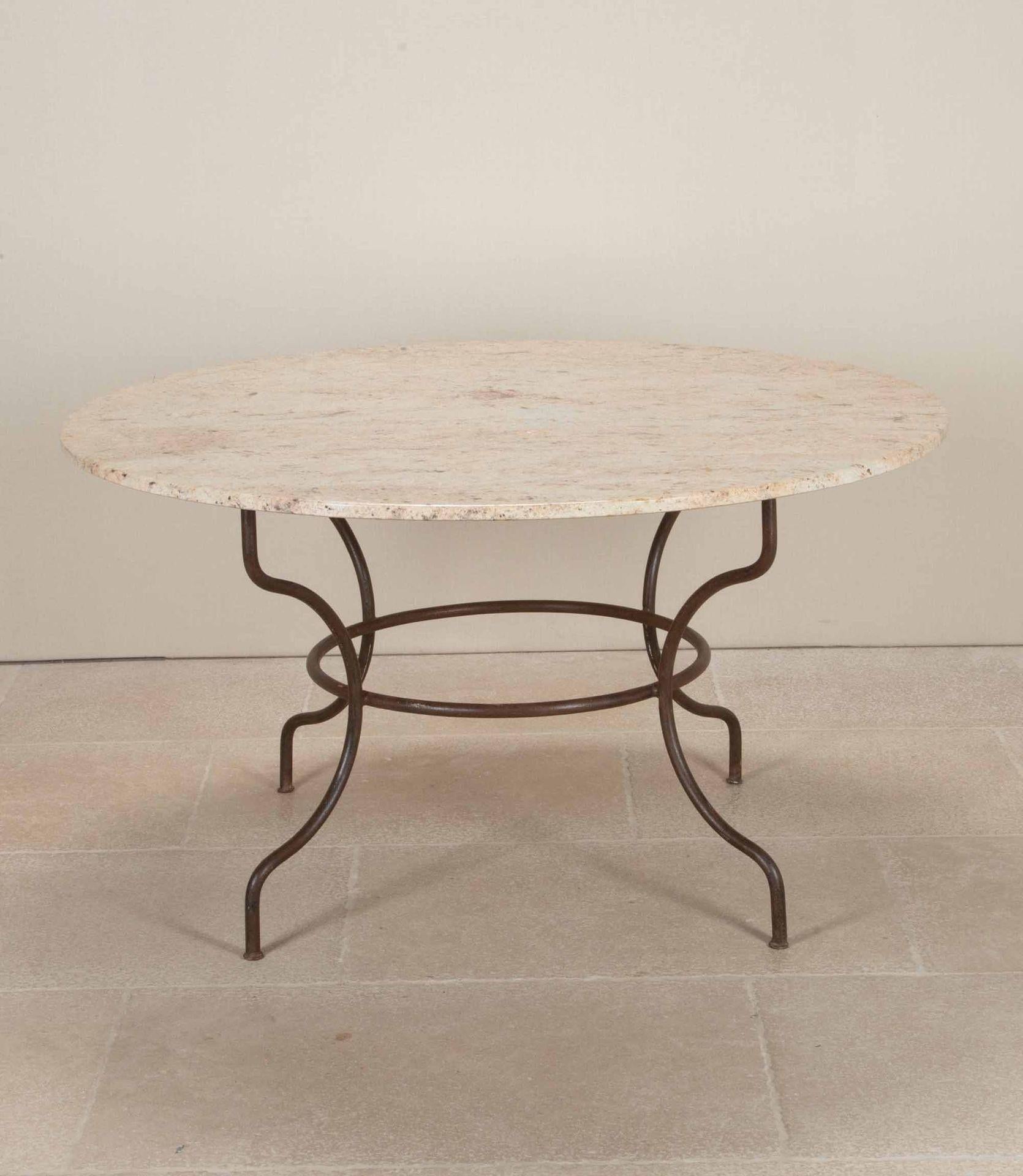 Large late 19th Century French wrought iron and marble top table. With a lovely patina to the iron base. Circa 1890.