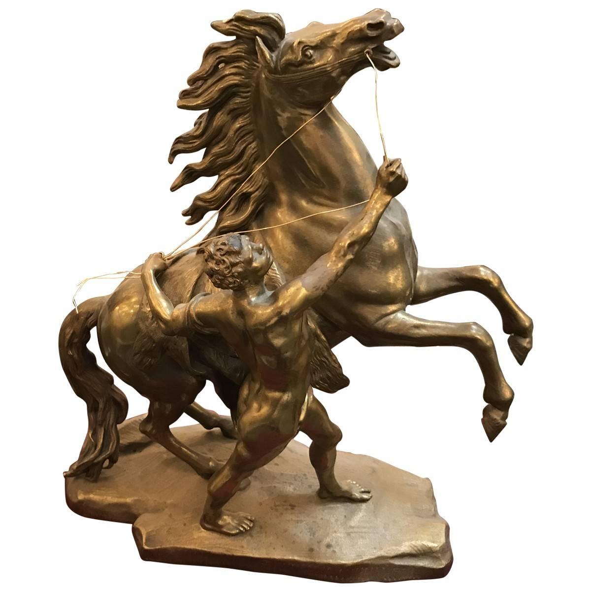A collectible piece from bygone days, featuring the finest craftsmanship, materials, and design elements of its given era. Sleek and unique, this eye-catching pair of cast brass horses and figures features bronze wire reins. These artful sculptures