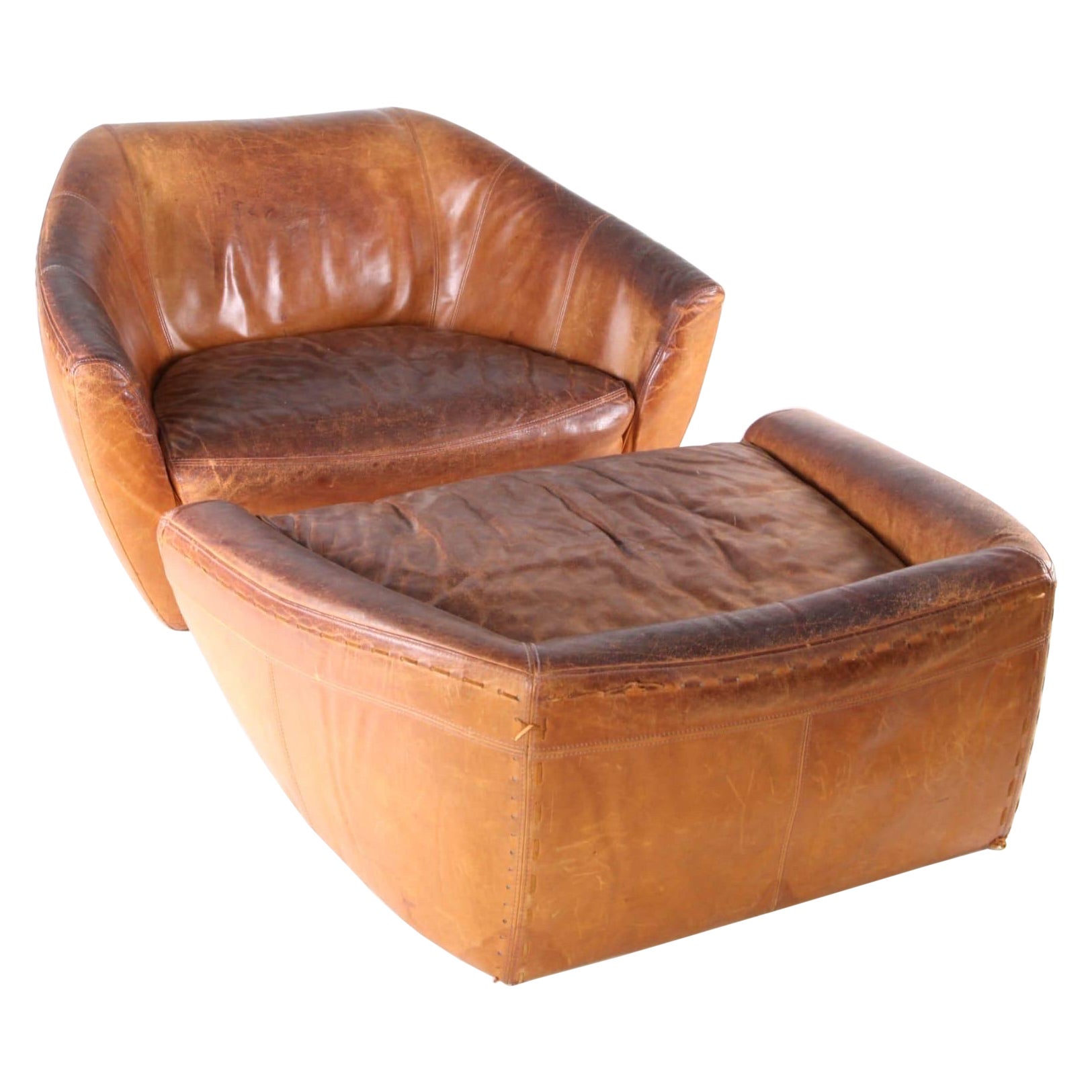 Grand fauteuil et ottoman en cuir