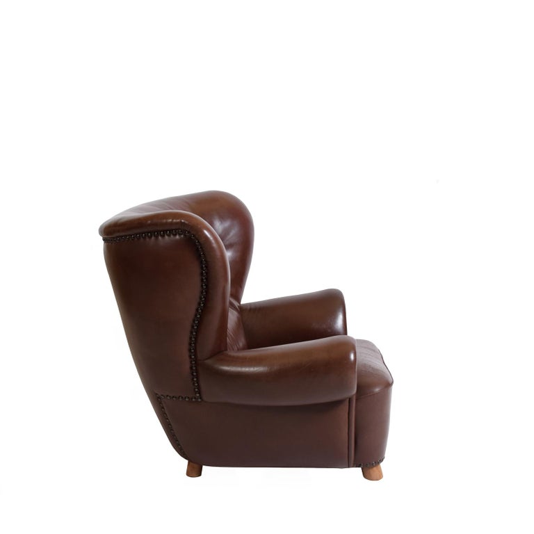 A really exceptional club chair from Denmark.   Large, sturdy and comfortable, Danish modern, covered in 
reddish-brown leather in excellent condition from 1930's.