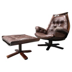 Large leather swivel chair with footstool from the 1960s