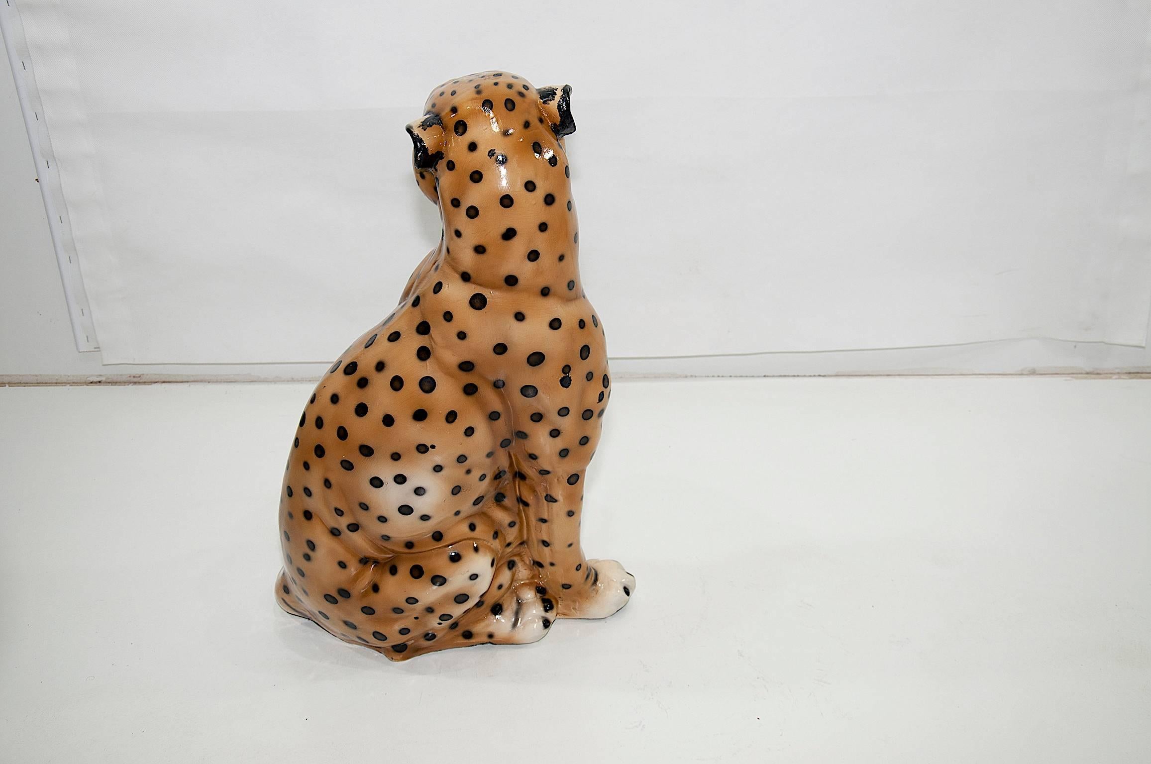 This is a vintage terracotta from Italy representing a seated Leopard. You can see realism in the mouth the eyes and the teeth.
The colors are yellow orange and black. This sculpture has been realised in the 1950s years.
In the price of the