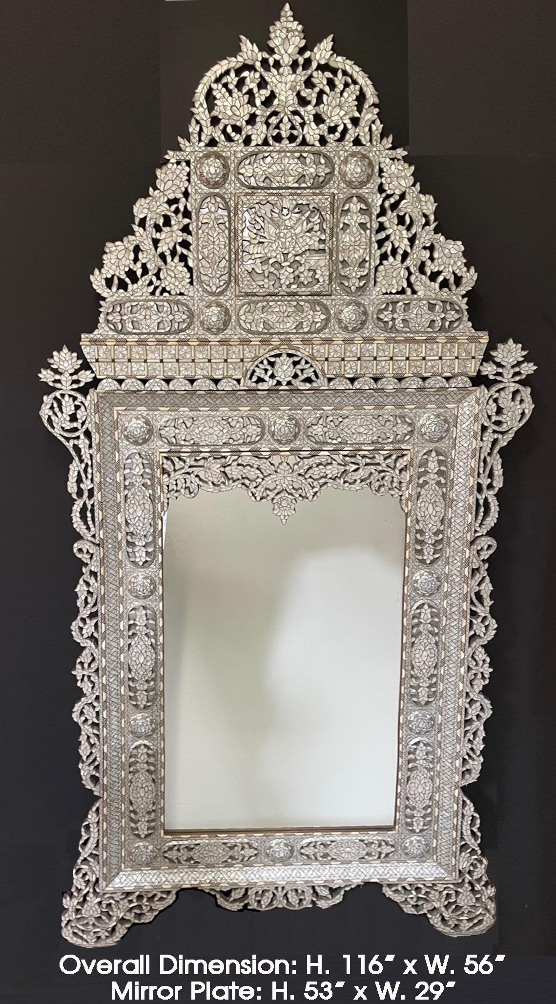 Sensational and enormous Levantine mother of pearl and pewter inlaid mirror, late 19th/early 20th century. possibly Moorish 
The elaborate arabesques solid mirror is intricately encrusted with lustrous mother of pearl with sophisticated details,