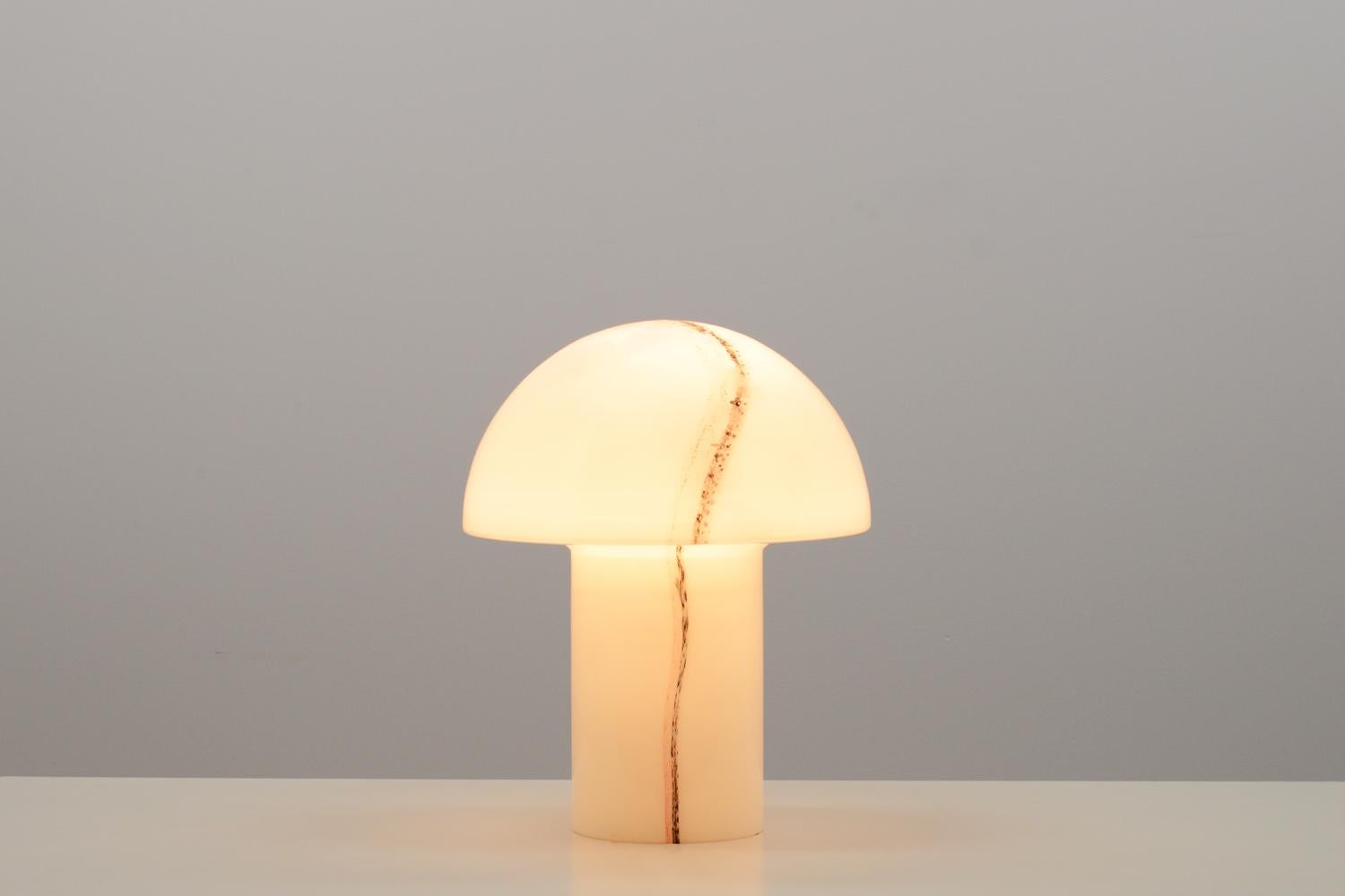 “Lido” mushroom table lamp by Peill & Putzler, Germany 70s. This is the larger version of 3. White glass with red and black striping. Holds a E27 buld. In very good vintage condition. 

 