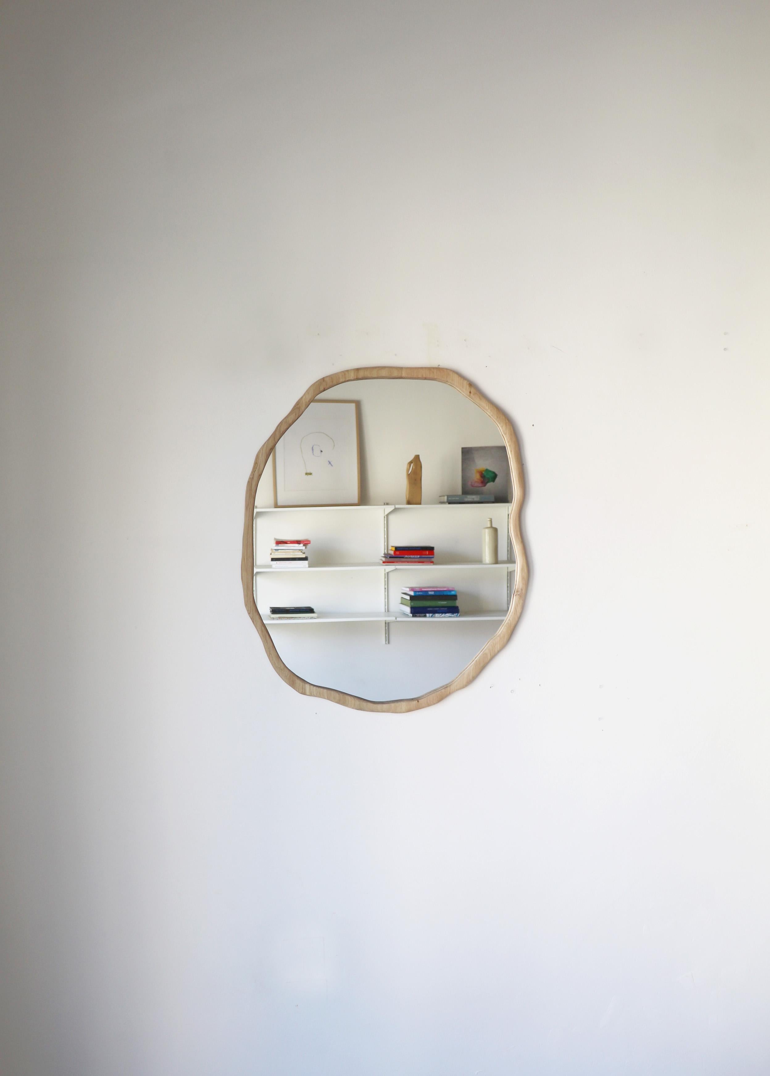 Large Light Varnish Ondulation Mirror by Alice Lahana Studio
Every mirror is unique. The shape slightly varies from edition to edition.
Dimensions: 60x70 cm
Materials: Oak.
Available finishing: Dark and light varnish

The Ondulation mirror is