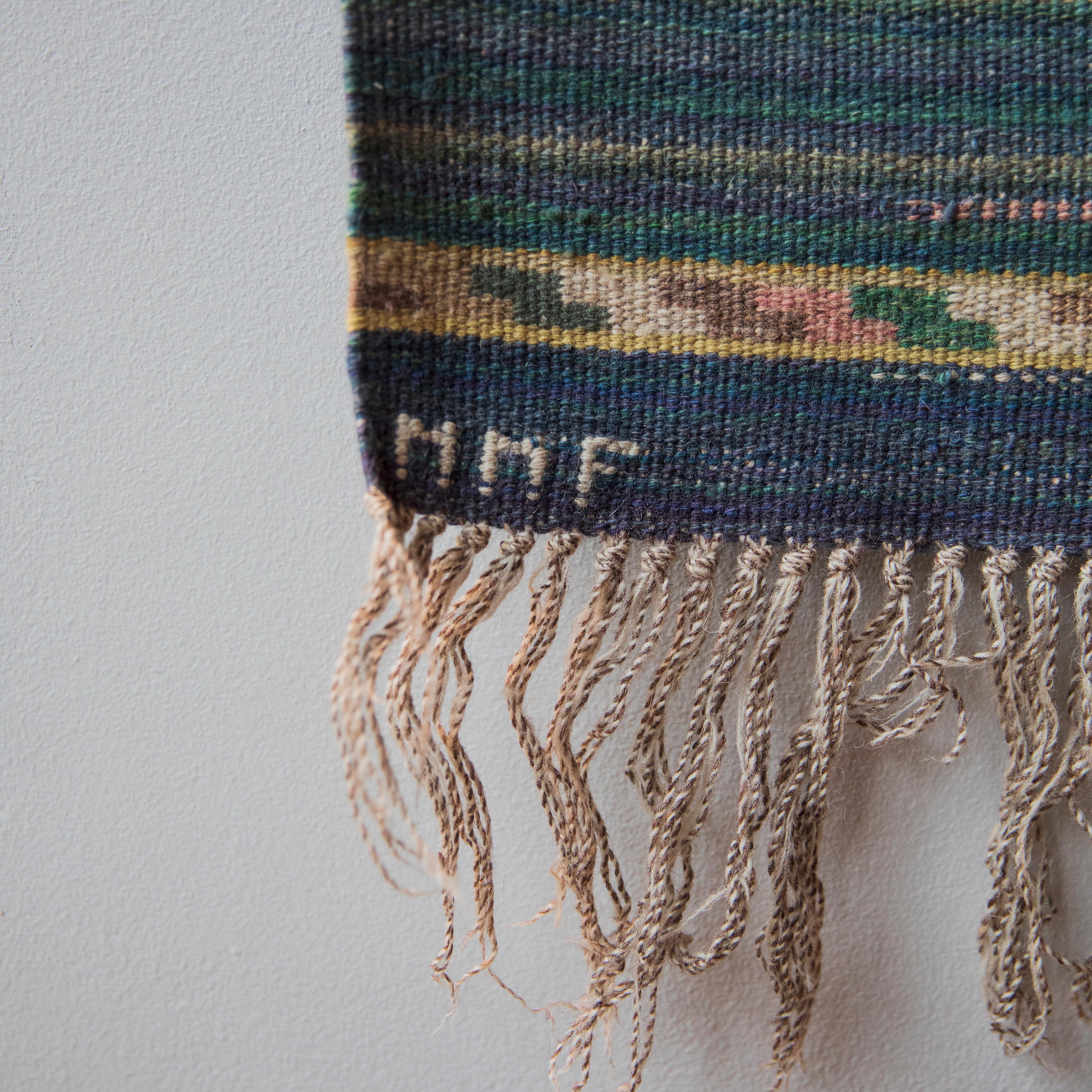 Description:
A three metre long flat-weave rug designed by Märta Måås-Fjetterström, Sweden, circa 1930 and made before 1941. The base of the composition is made up of 42 alternating bands of blue and green. These main colours are not block tones but