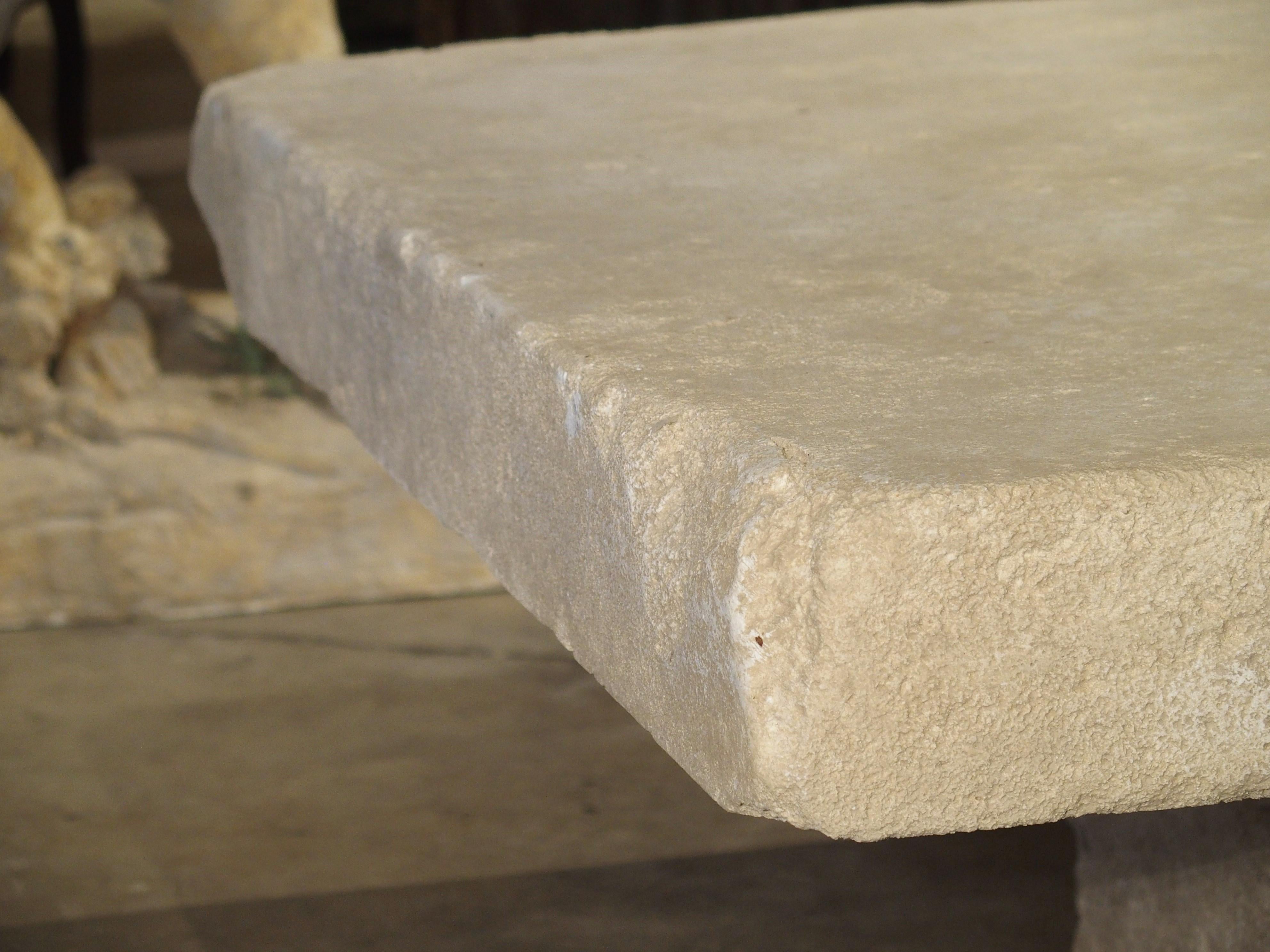 This versatile coffee table from the South of France has been carved from the famous Estaillade stone of Provence. The top slab is made from one thick piece of limestone, and the base also made from one big block. This table can be used with any