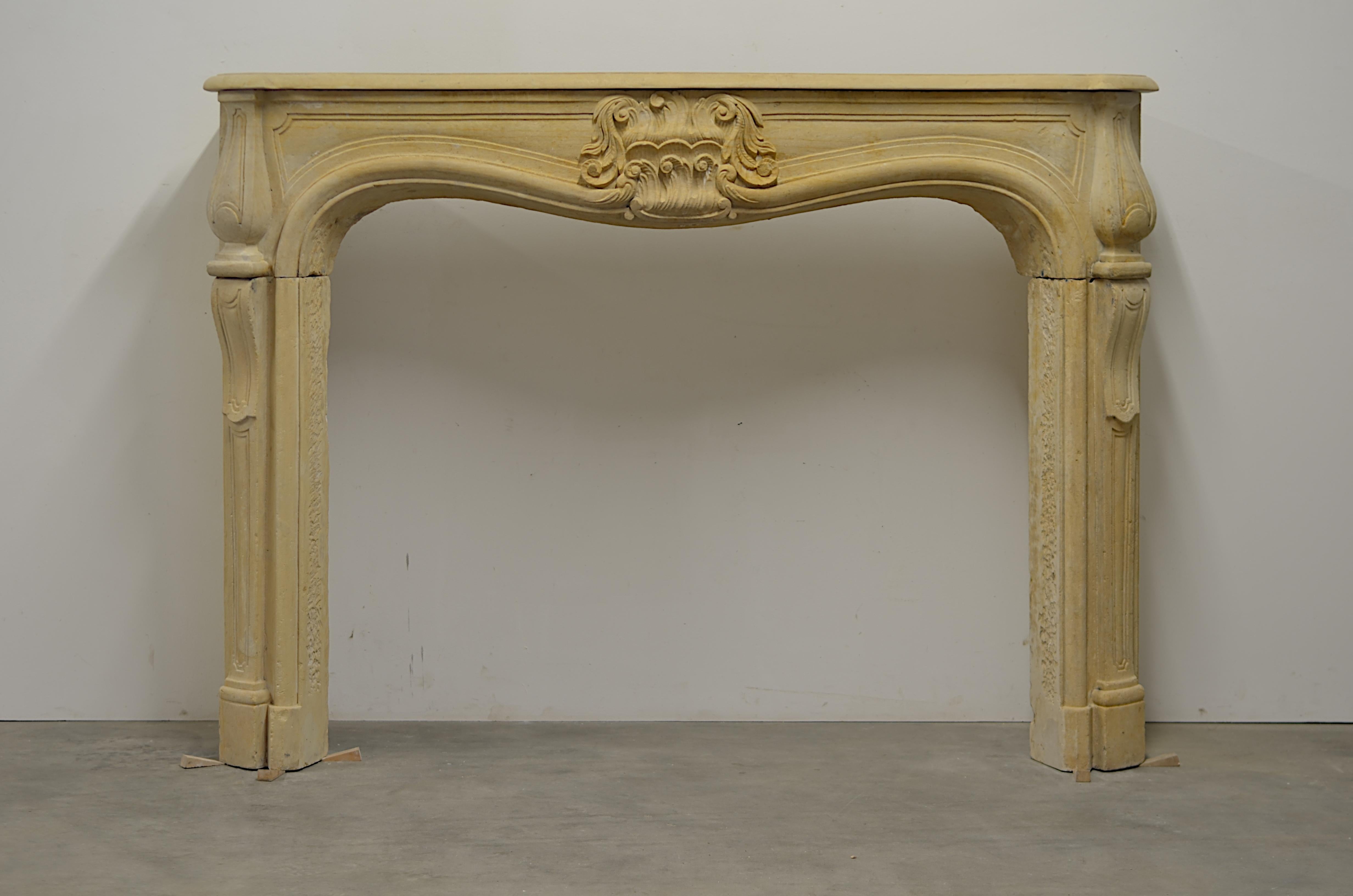 Large and impressive French Louis XV fireplace mantel.
This strong late 18th century has an amazing central cartouche. Its strong, decorative and very crisp even after all those years. 

This makes an amazing statement and is suitable for any kind