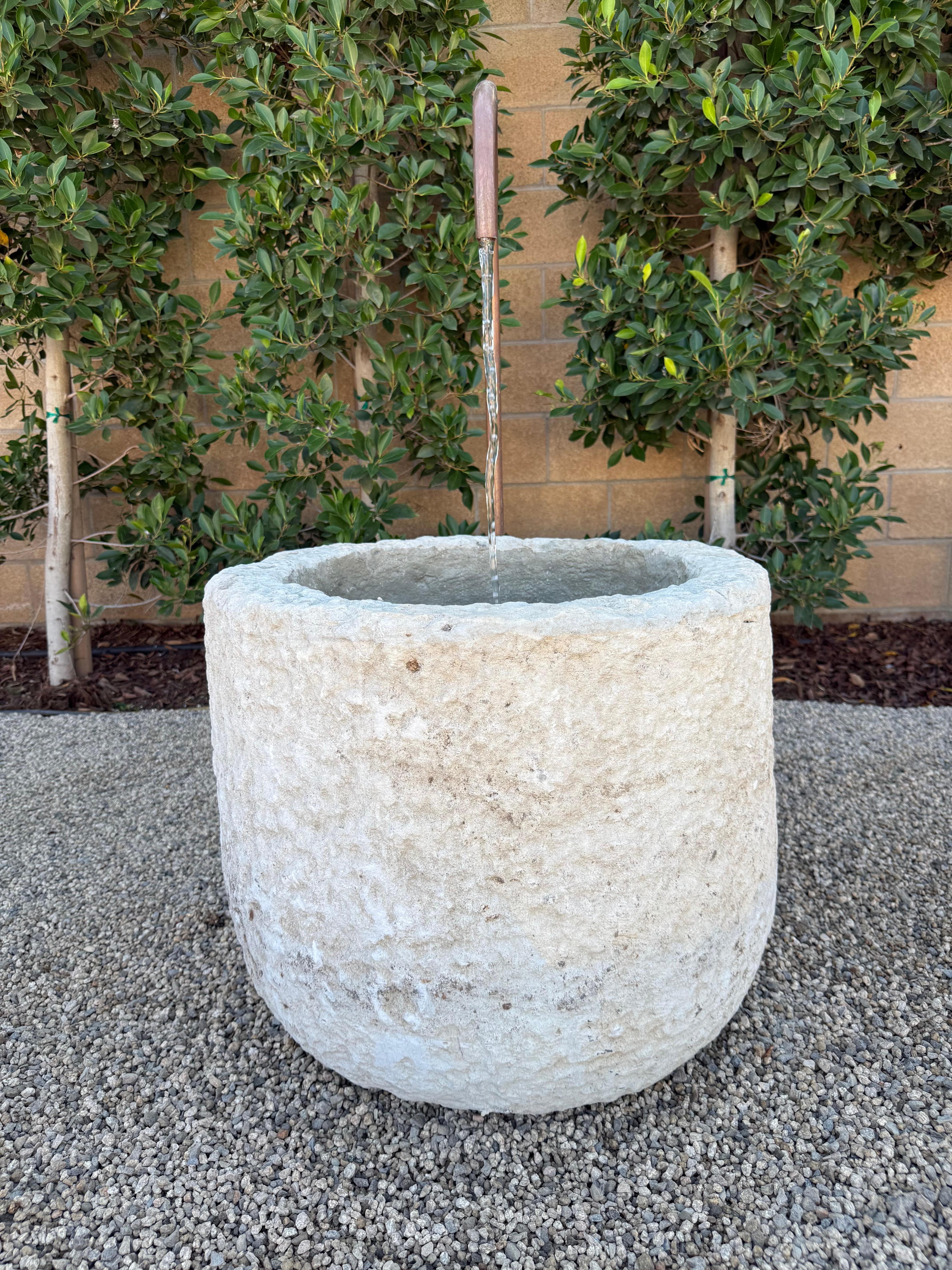 We've transformed this beautiful large limestone trough into a fountain, using copper piping that will patina even more over time turning a rich brown color. This fountain has the option to use the lights we included, There is an on-off switch for